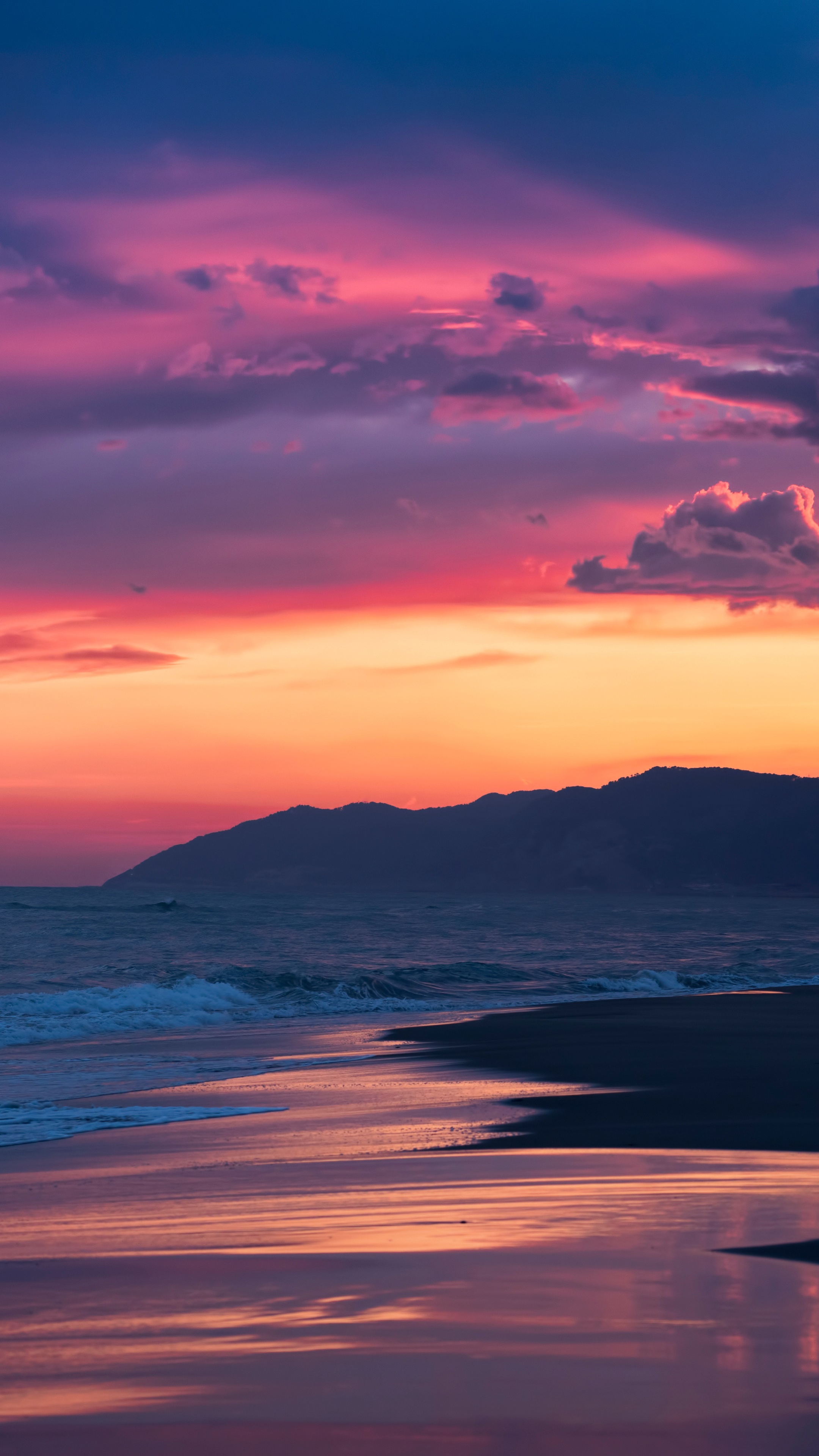 Sunset over the ocean with mountains HD Phone Wallpaper