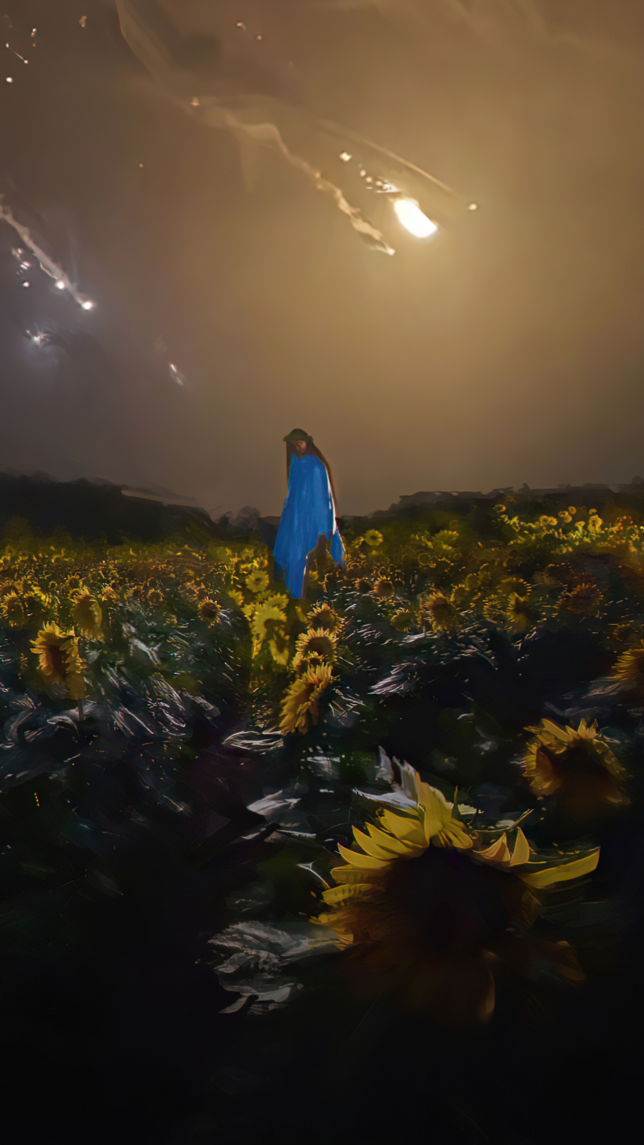 Person in blue poncho in sunflower field at night HD Phone Wallpaper