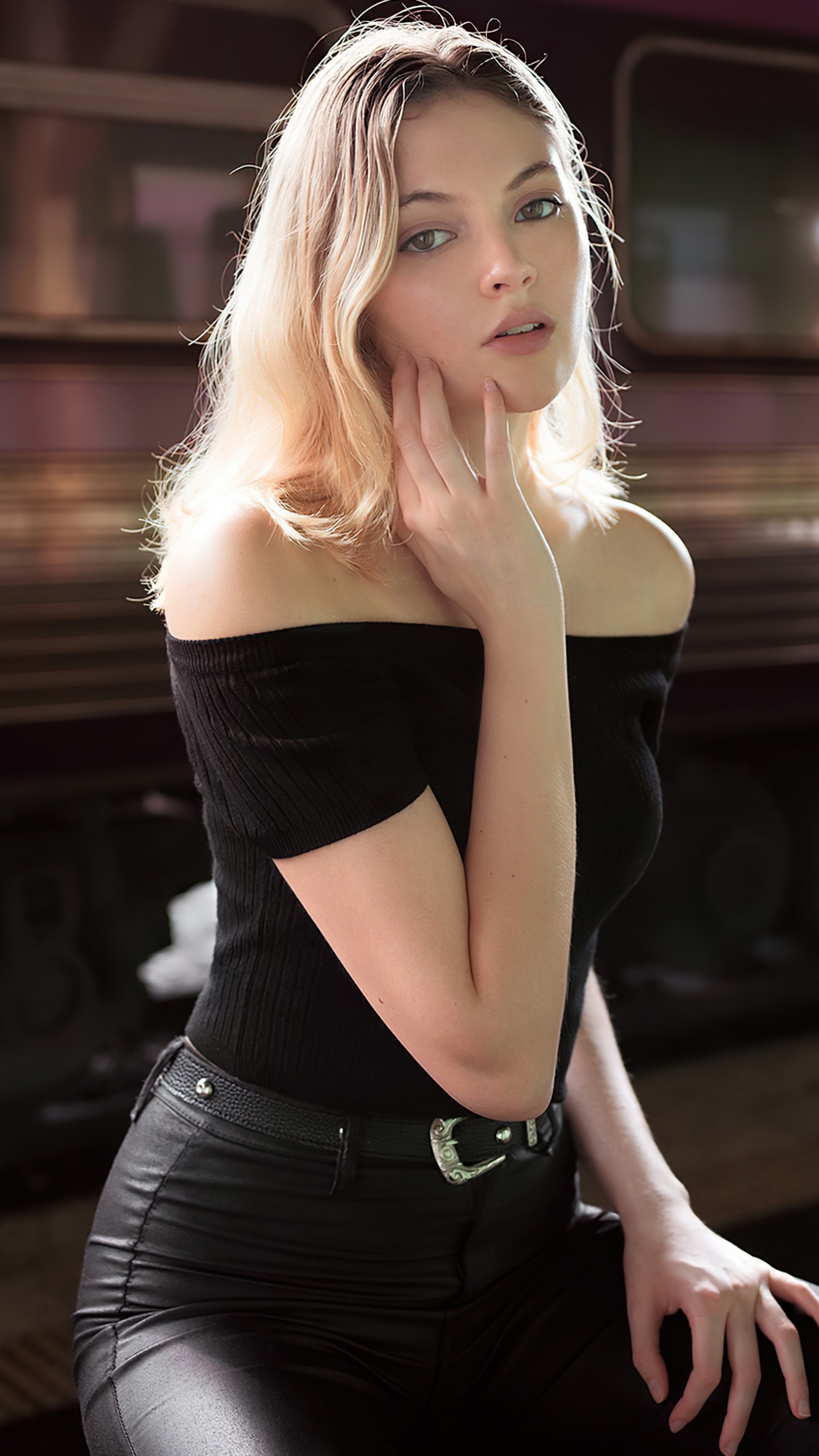 Model in black off-the-shoulder top and leather pants HD Phone Wallpaper