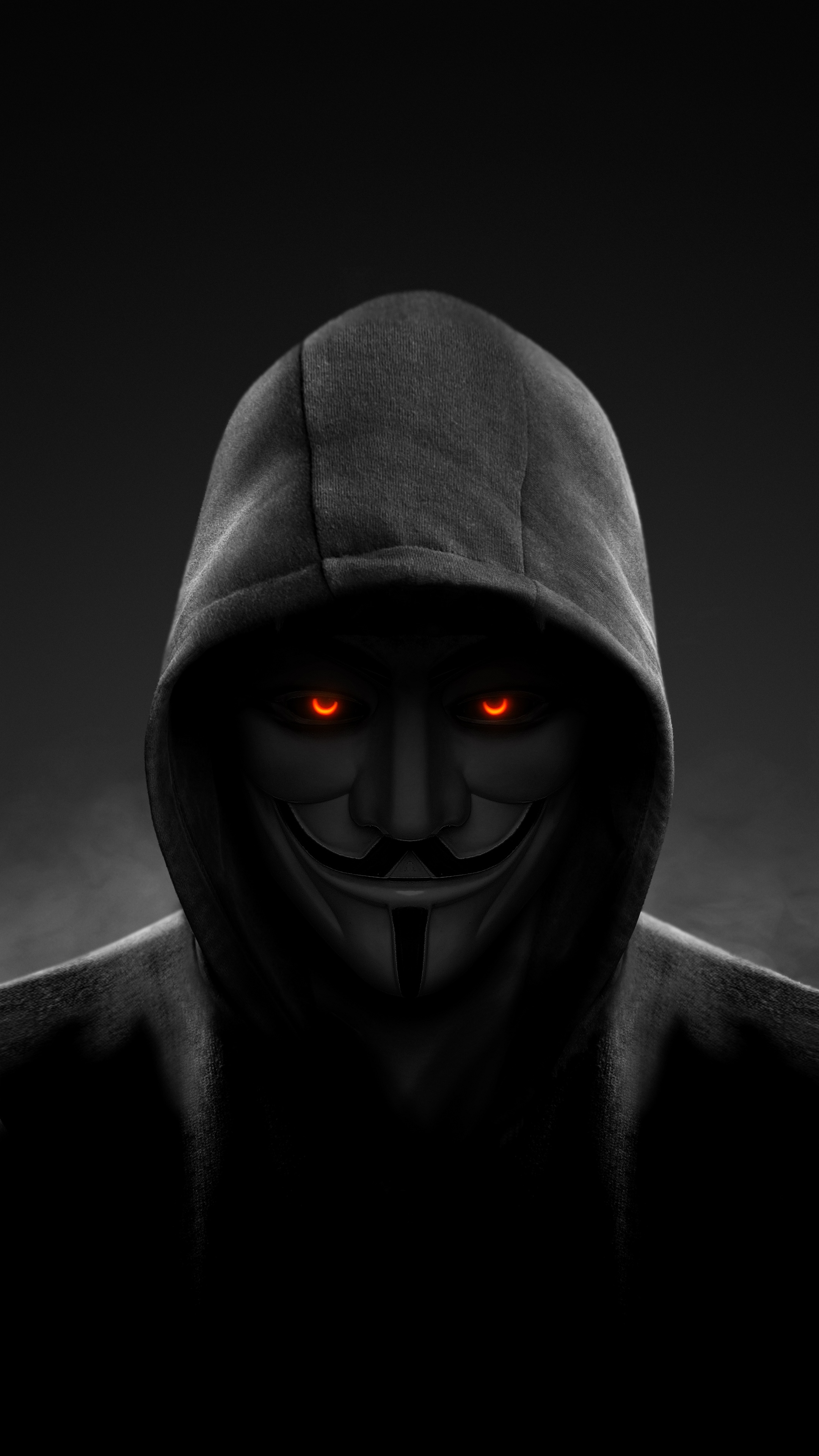 Anonymous Hacker with Fiery Eyes in Hoodie HD Phone Wallpaper