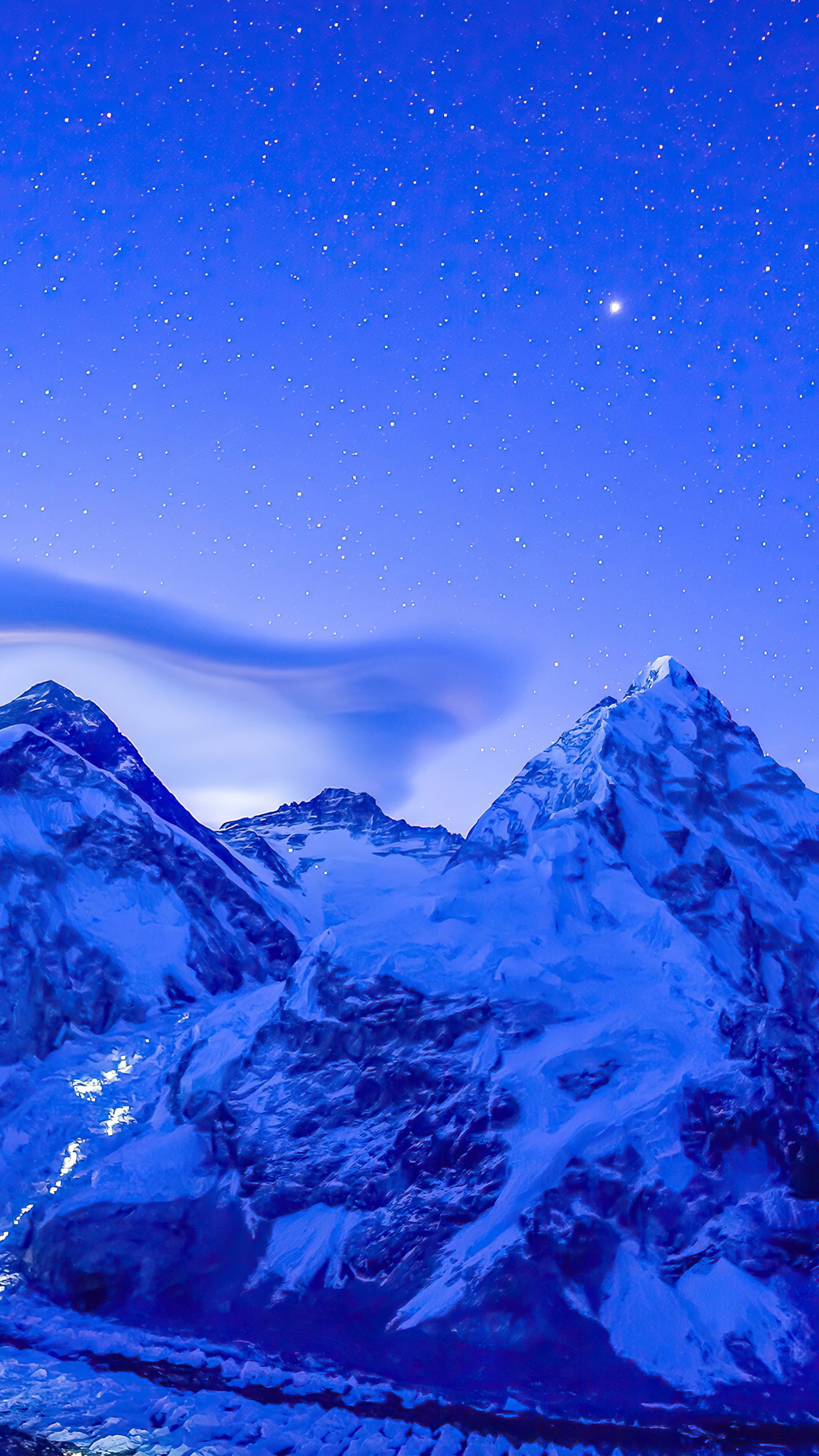 Snowy mountains under a starry night sky HD Phone Wallpaper