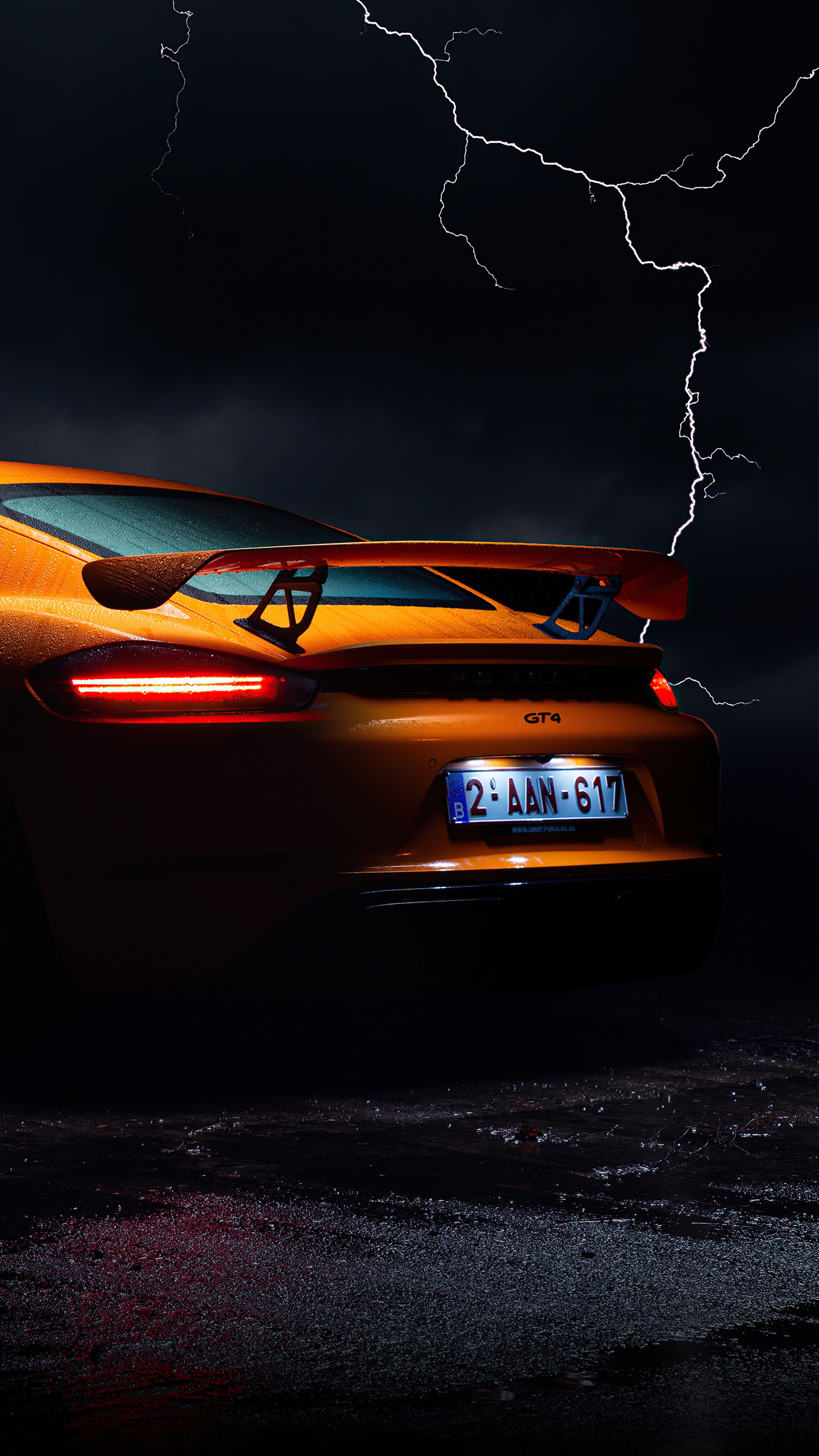 Orange Porsche GT4 with Lightning Storm HD Phone Wallpaper