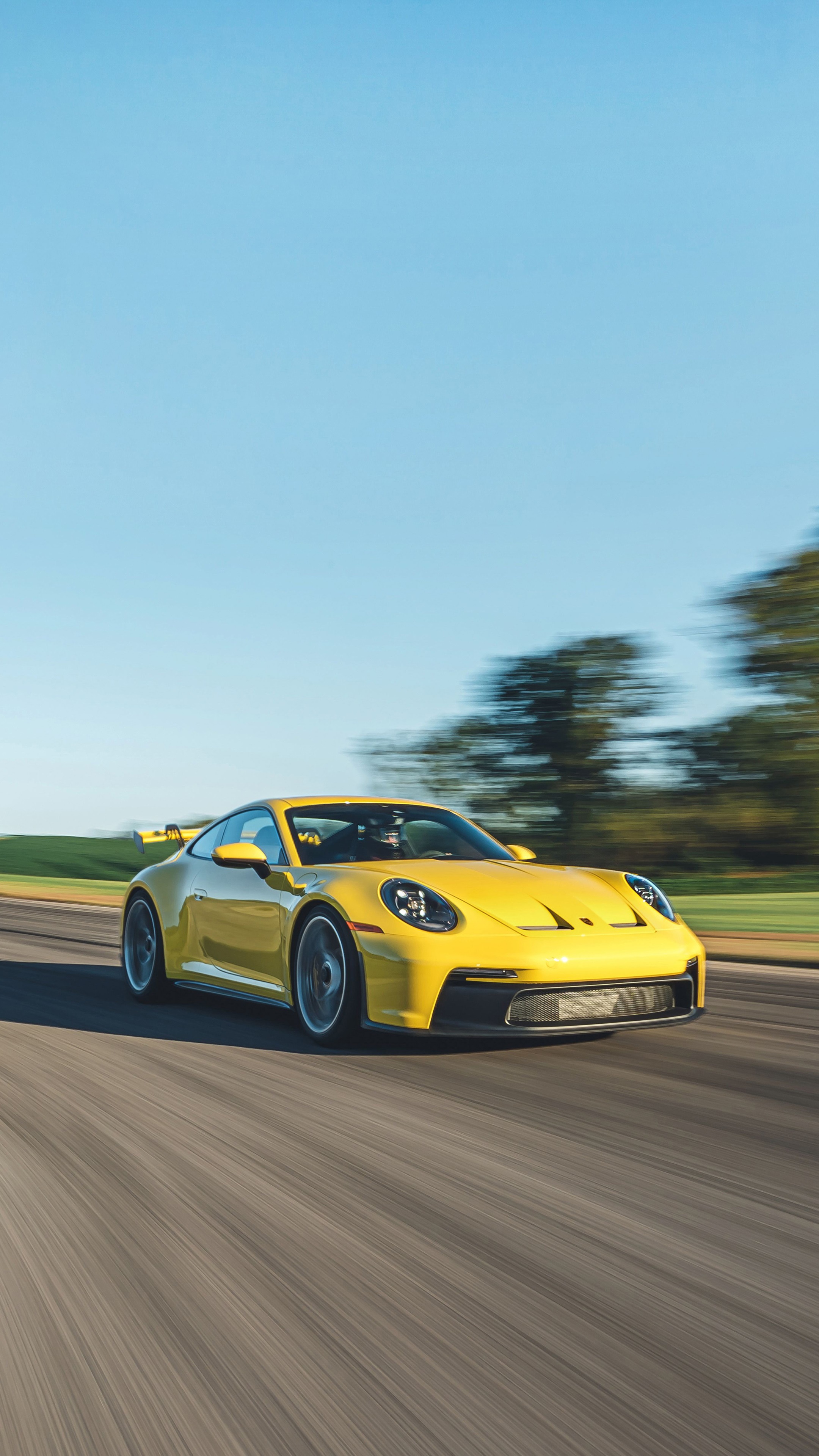 Yellow Porsche 911 GT3 on a Racetrack 4K HD Phone Wallpaper