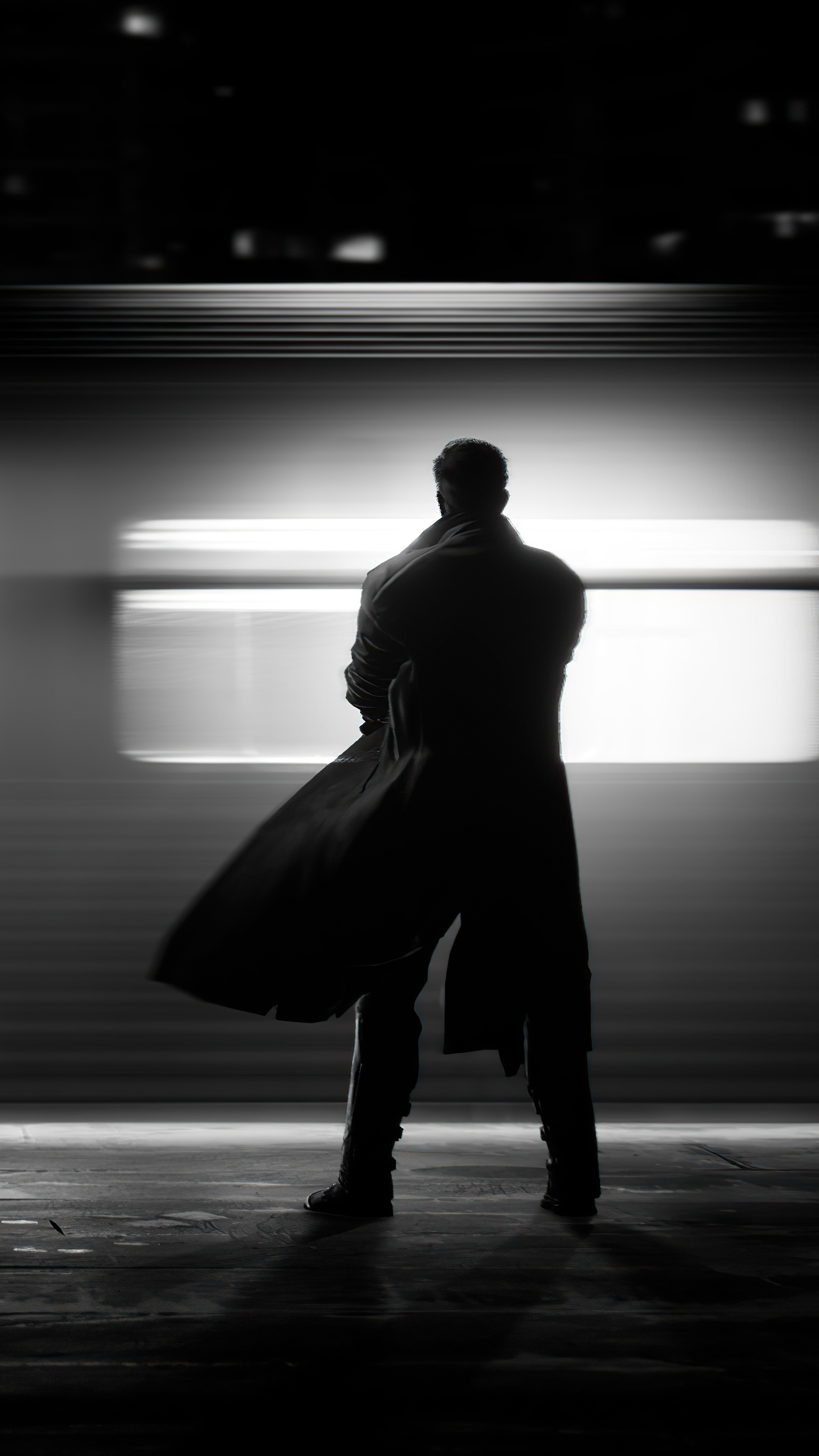 Silhouette of a man in a trench coat HD Phone Wallpaper