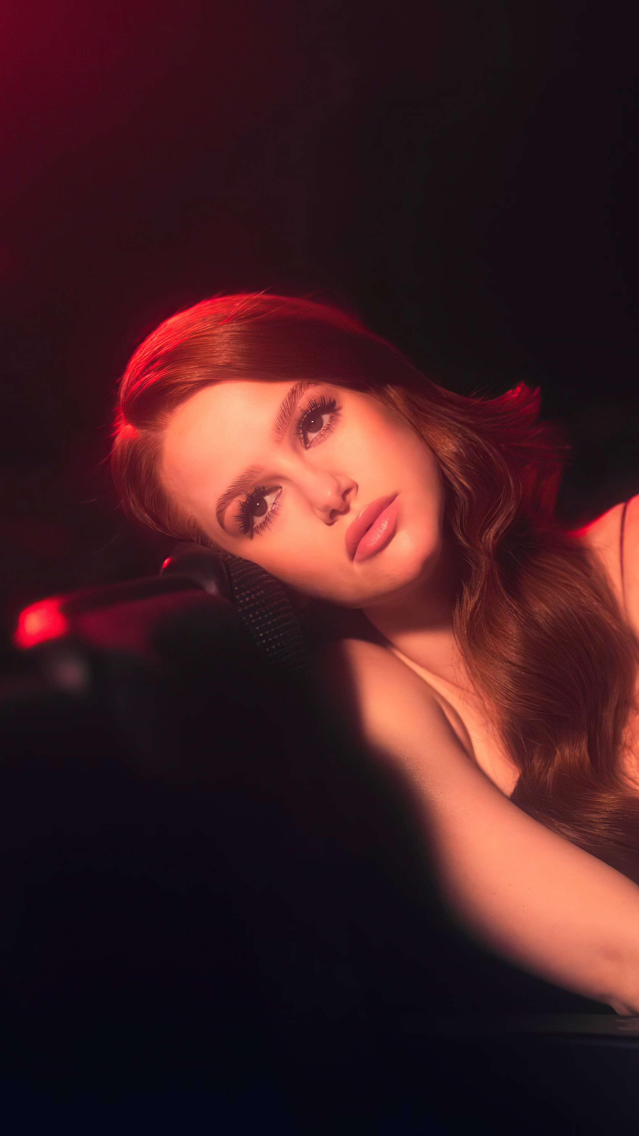 Madelaine Petsch in a red-lit photoshoot HD Phone Wallpaper