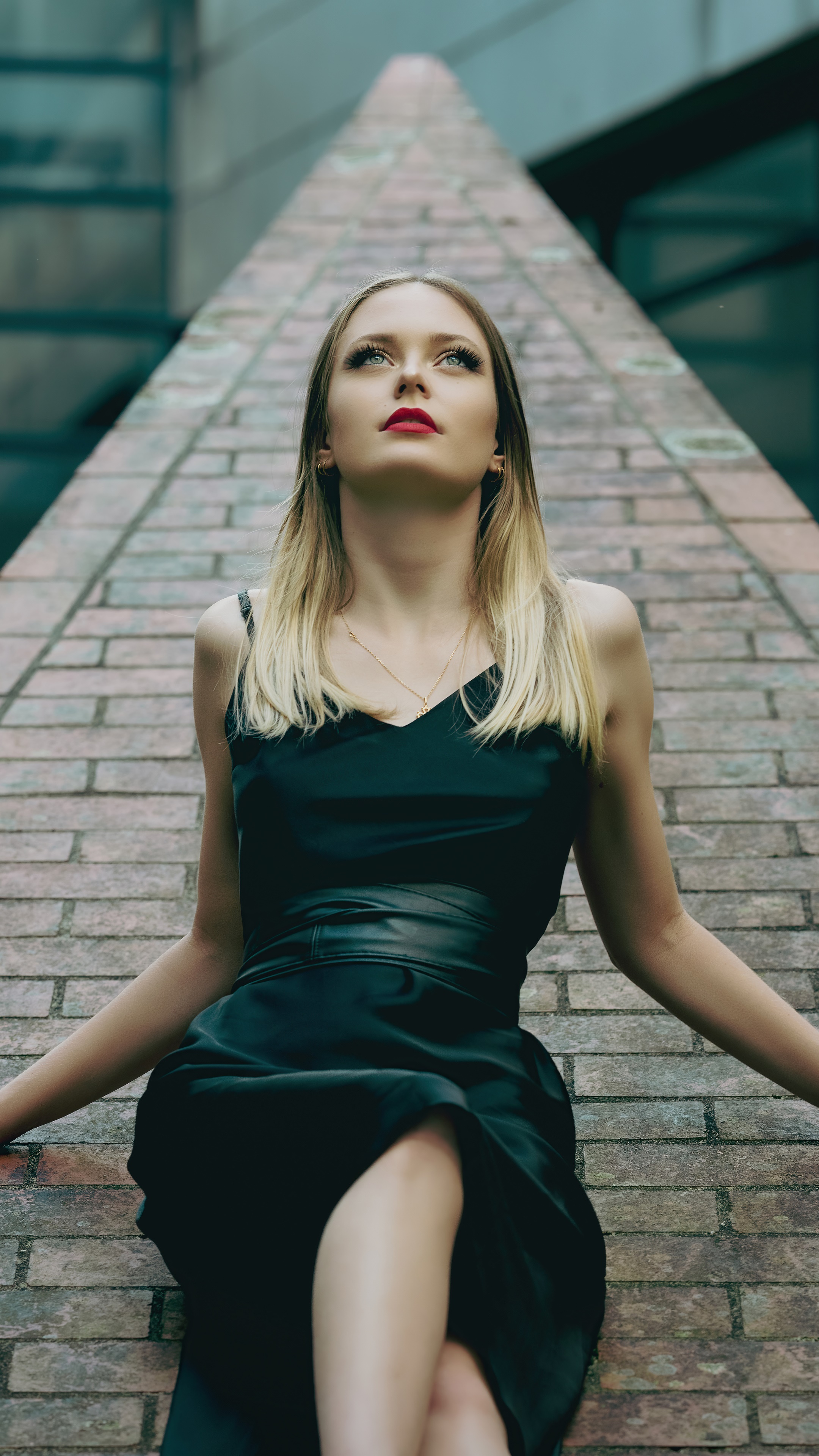 Woman in black dress posing on brick pyramid HD Phone Wallpaper