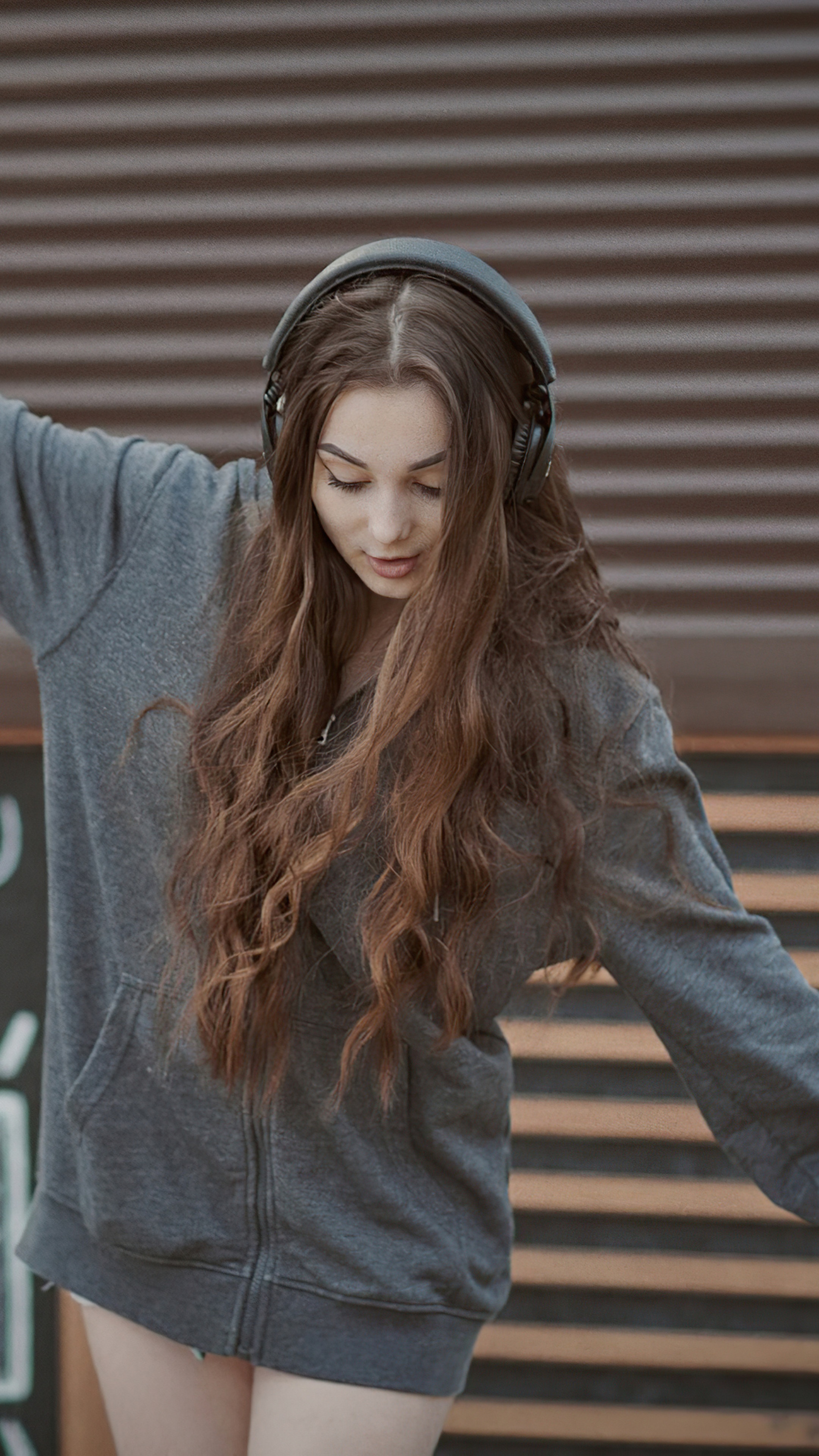 Girl with headphones wearing a hoodie HD Phone Wallpaper