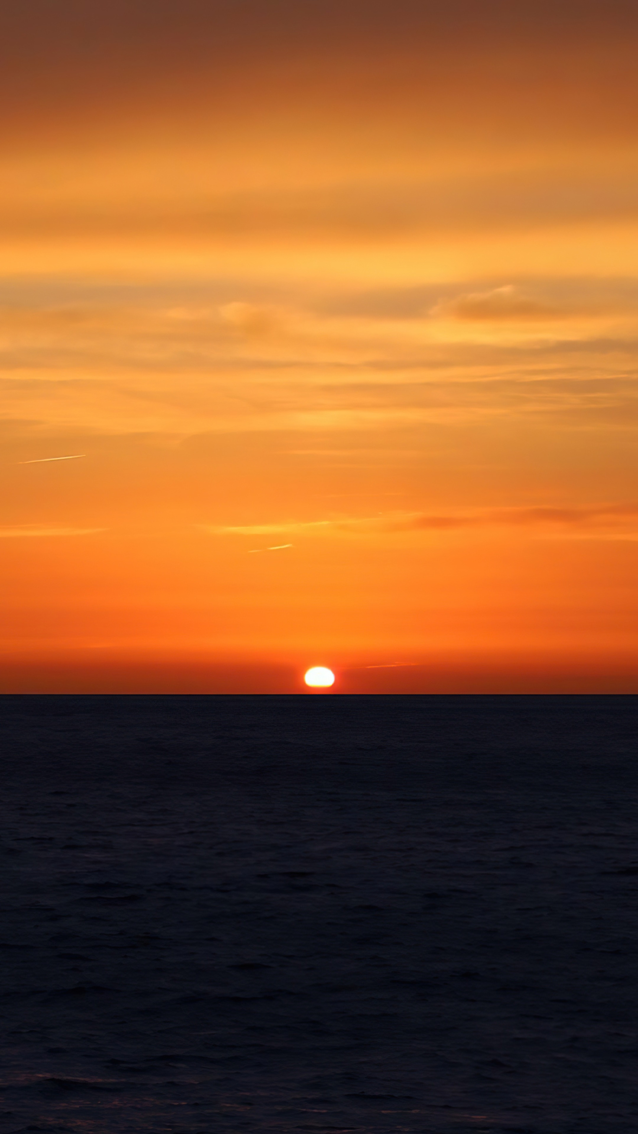Sunset over the sea at dusk HD Phone Wallpaper