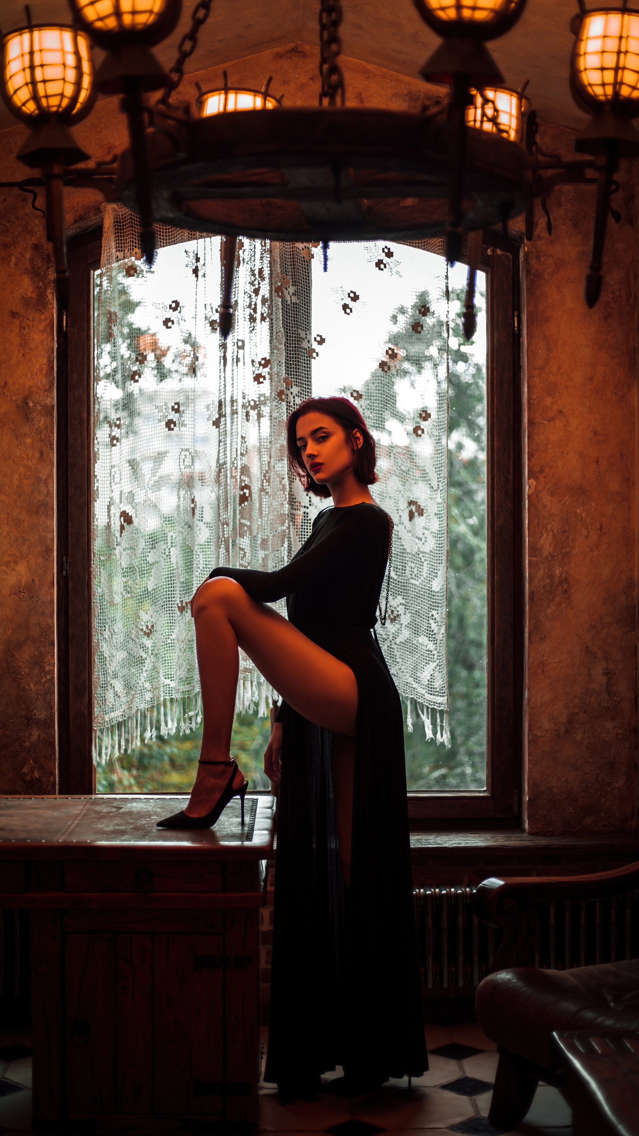 Model in a black dress by the window HD Phone Wallpaper