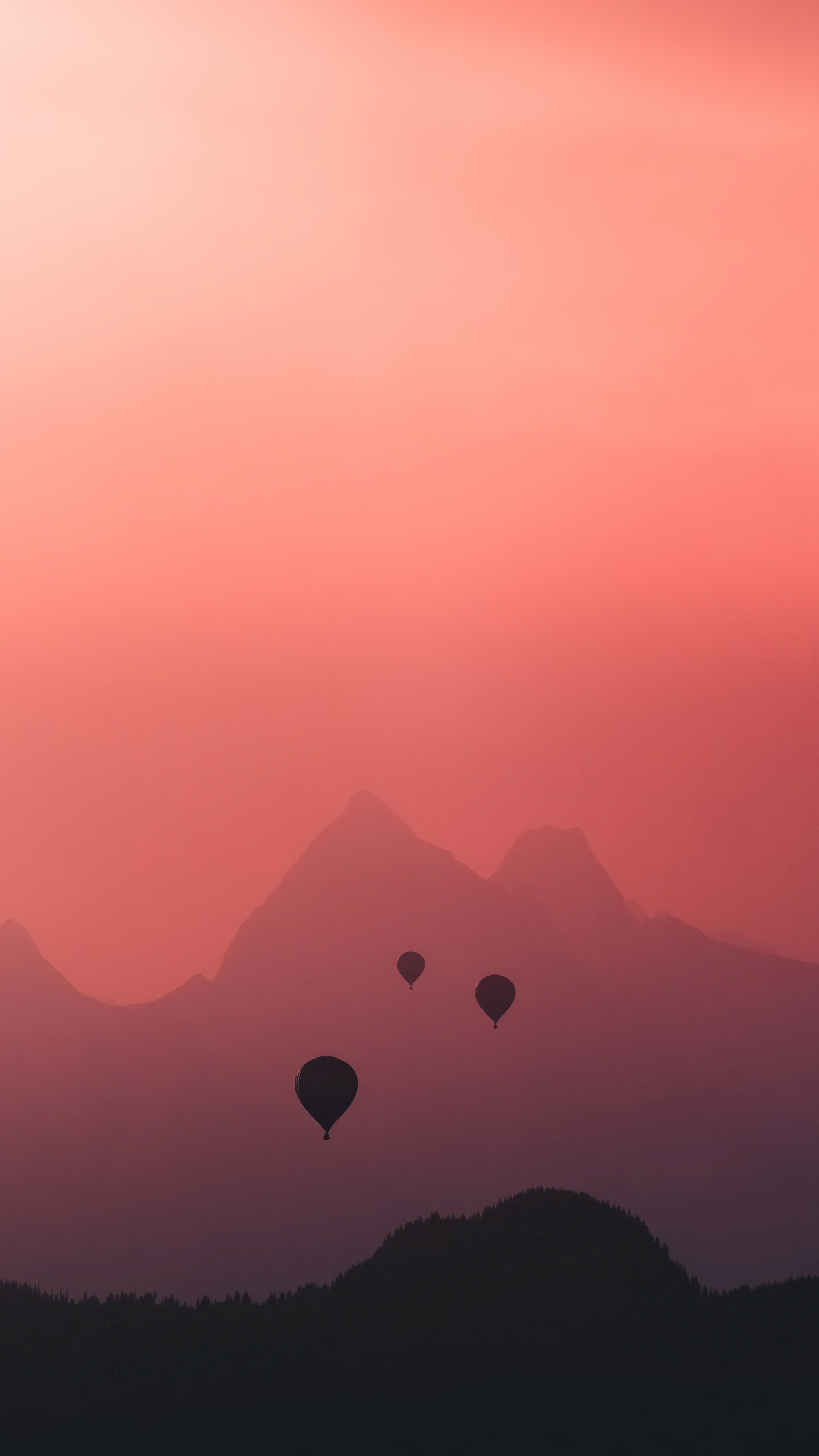 Hot air balloons over mountains at sunset HD Phone Wallpaper