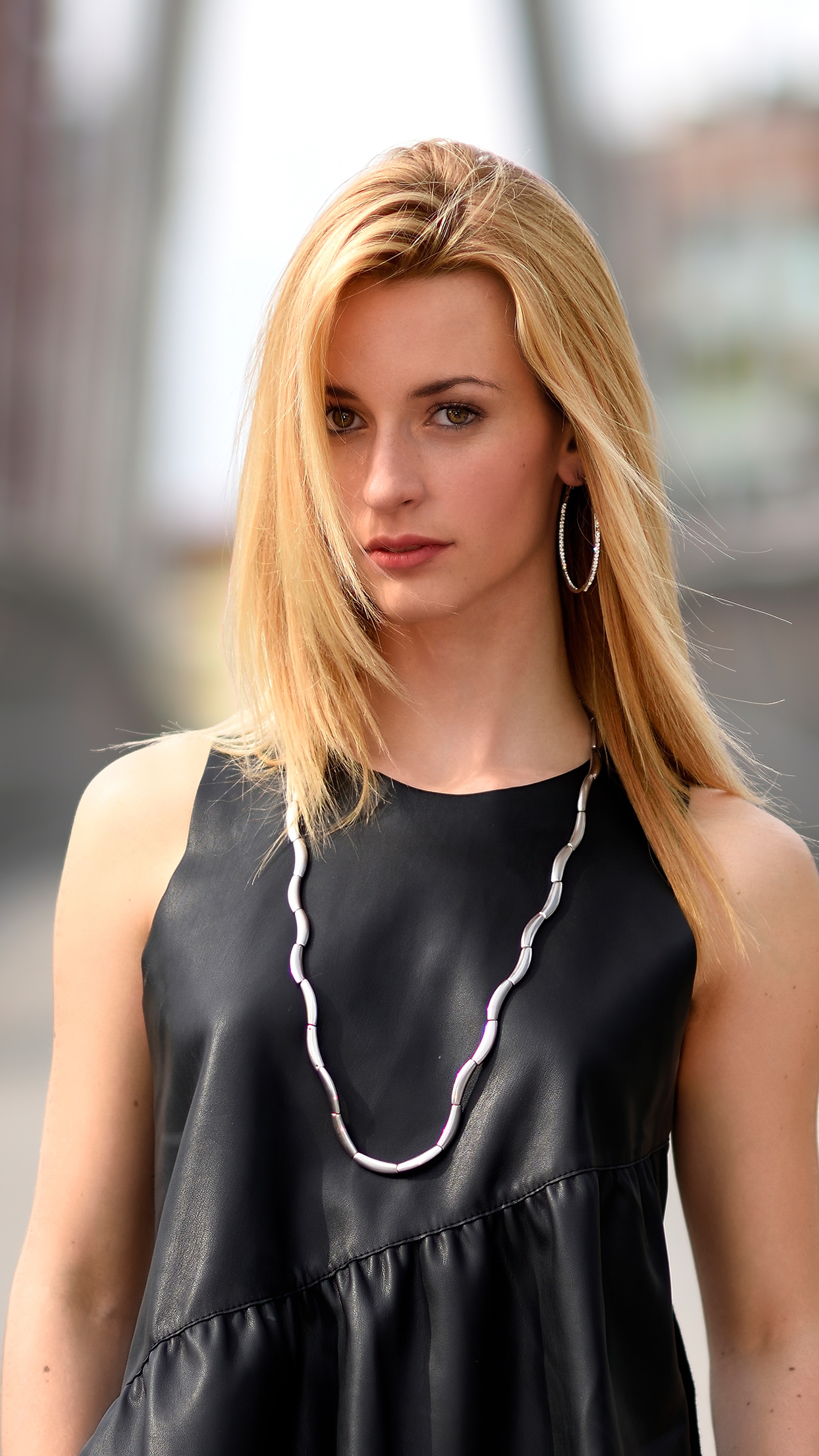 Model in black dress with necklace and earrings 4K HD Phone Wallpaper