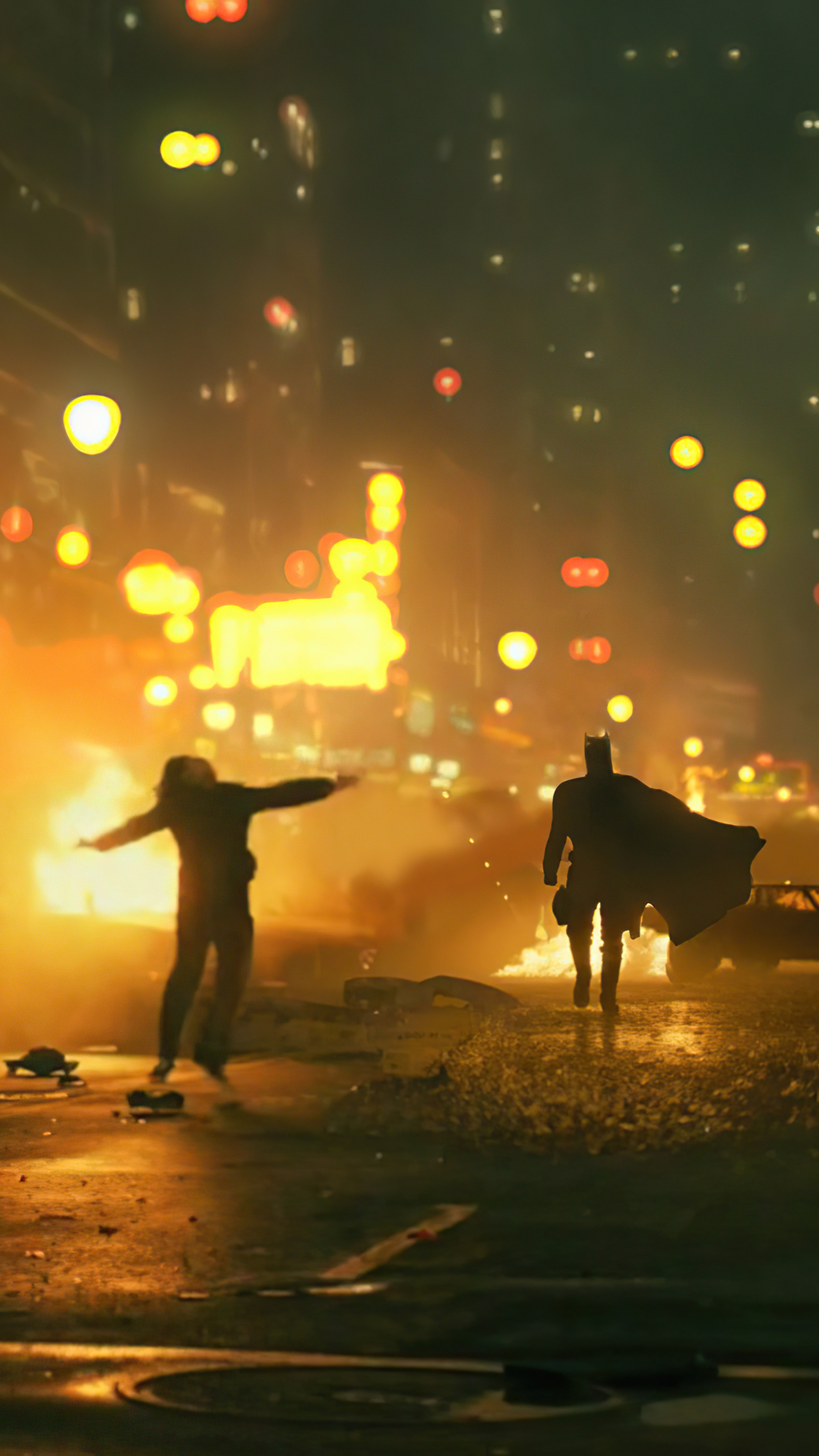 Batman and Joker in a burning city 4K HD Phone Wallpaper