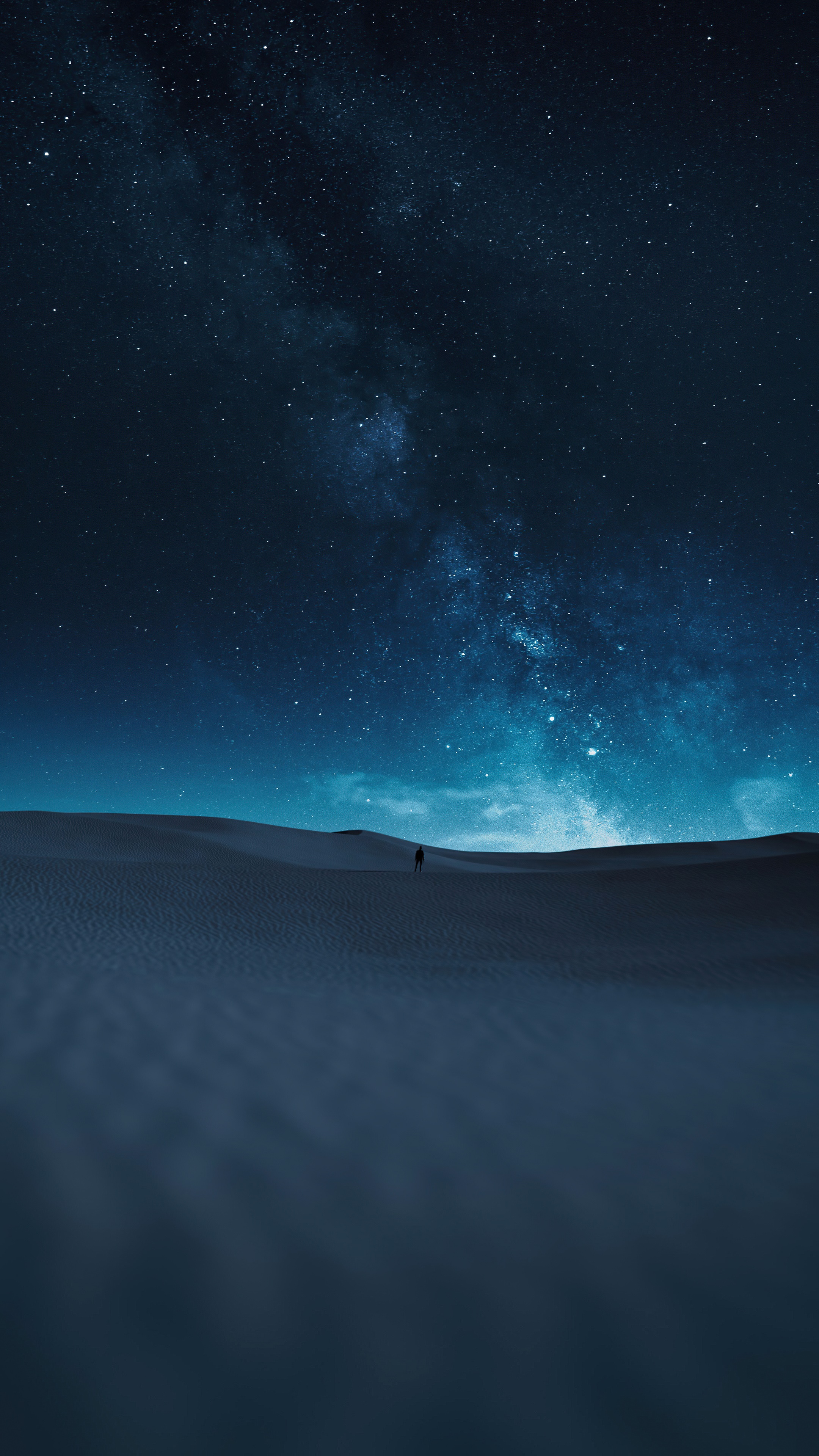 Man walking in desert under starry sky HD Phone Wallpaper