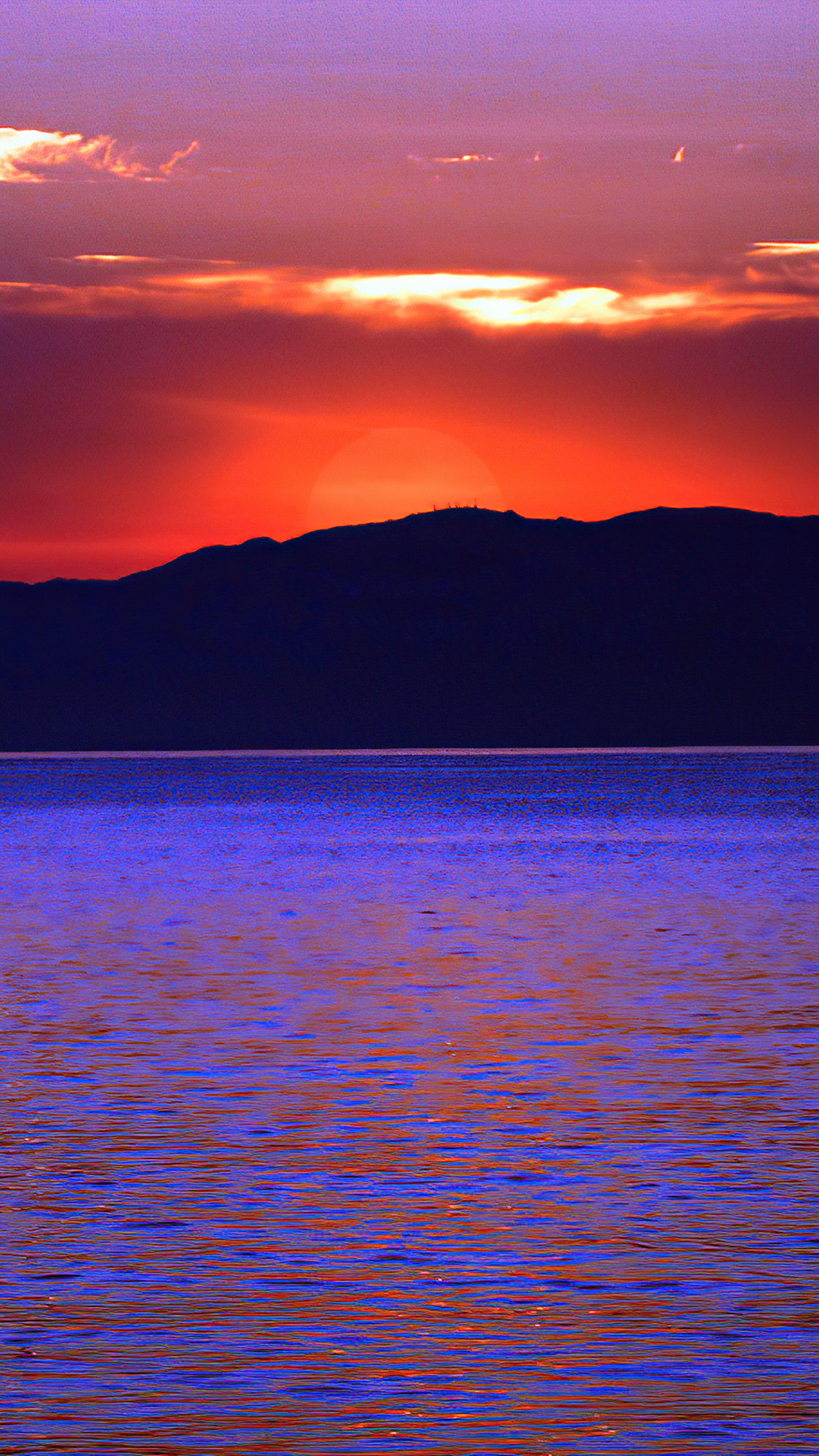 Sunset over mountains and water 4K HD Phone Wallpaper