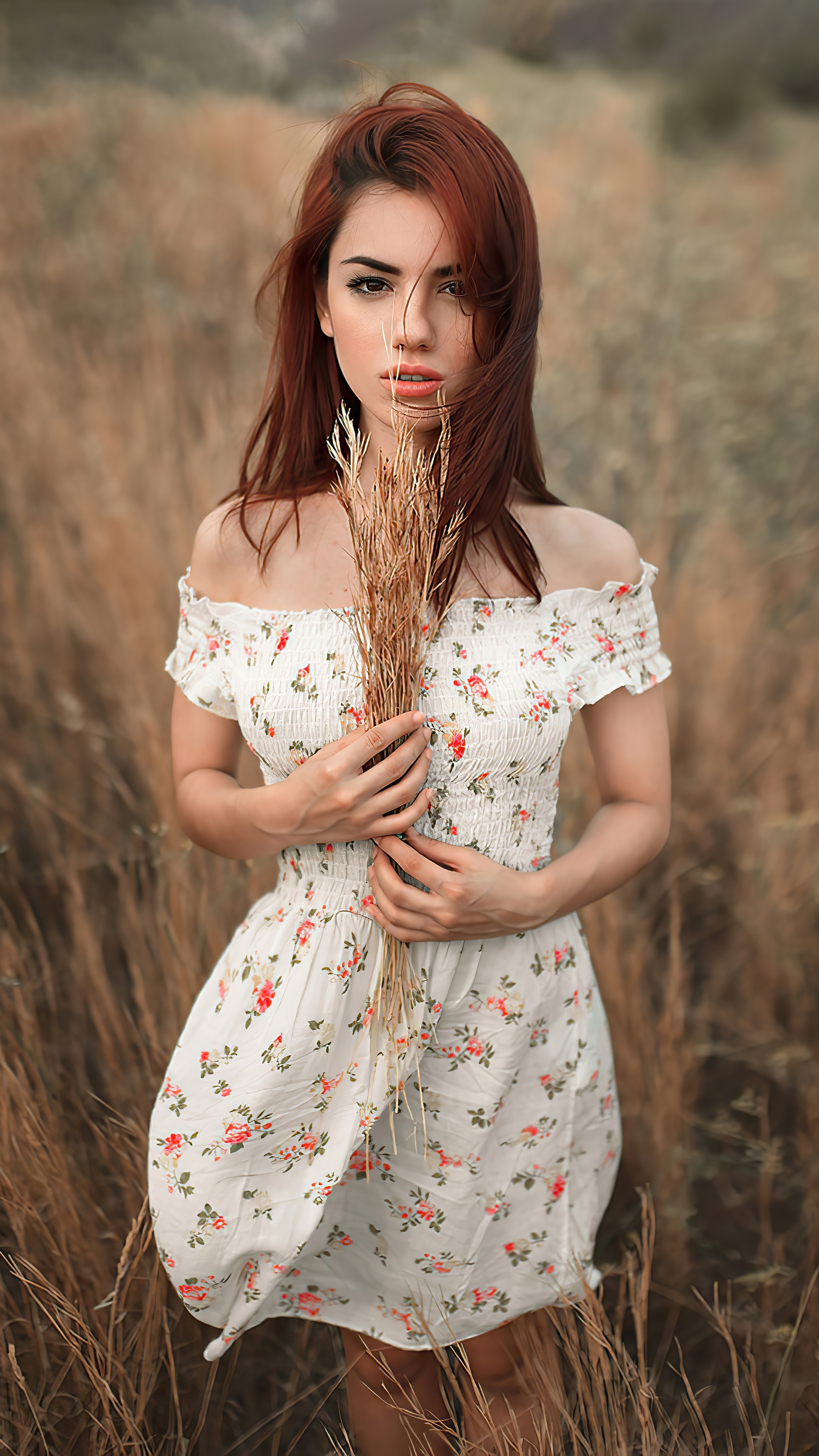 Woman with red hair in a floral dress in a field HD Phone Wallpaper