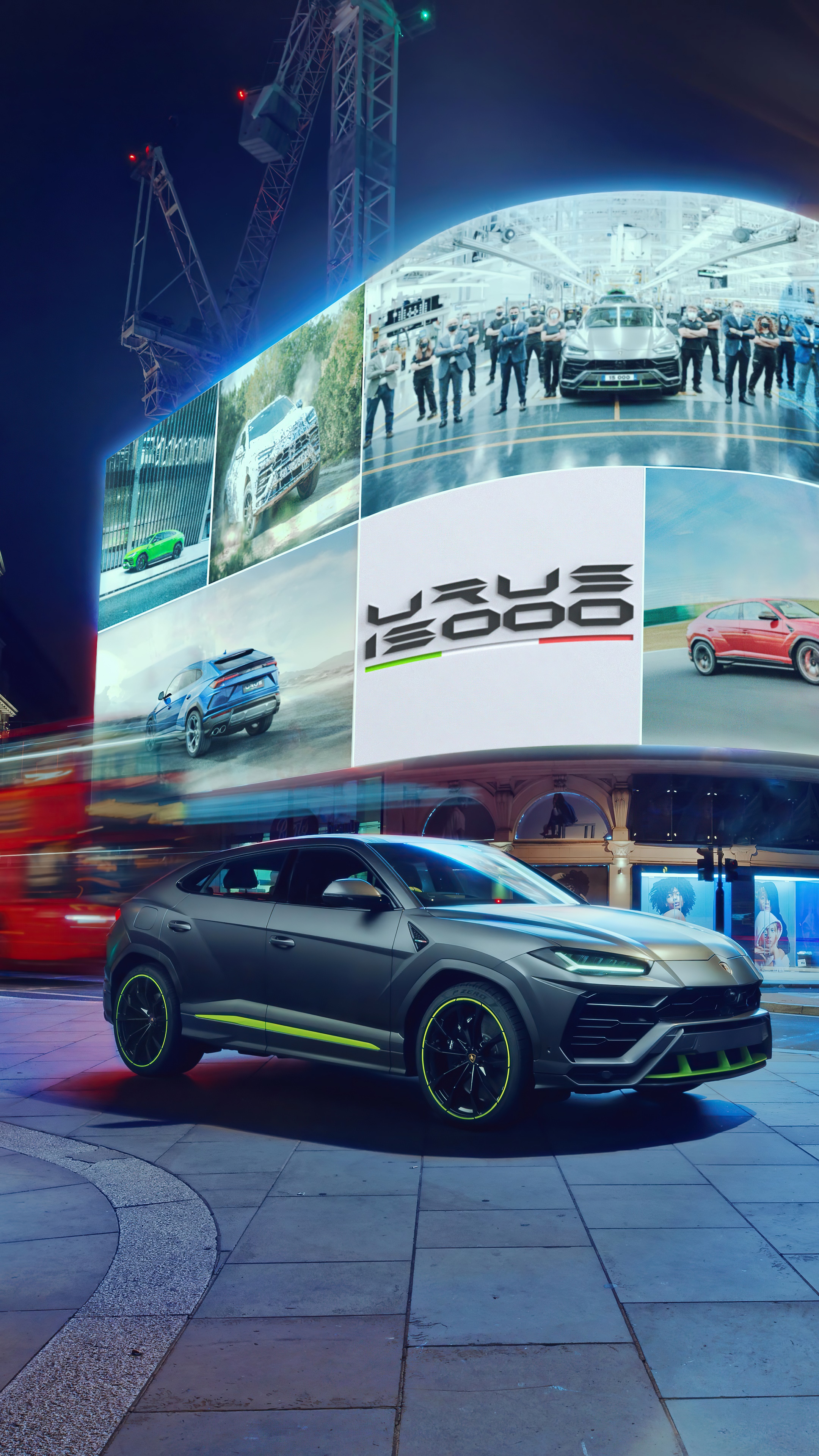Lamborghini Urus 15000 on display with digital billboards HD Phone Wallpaper
