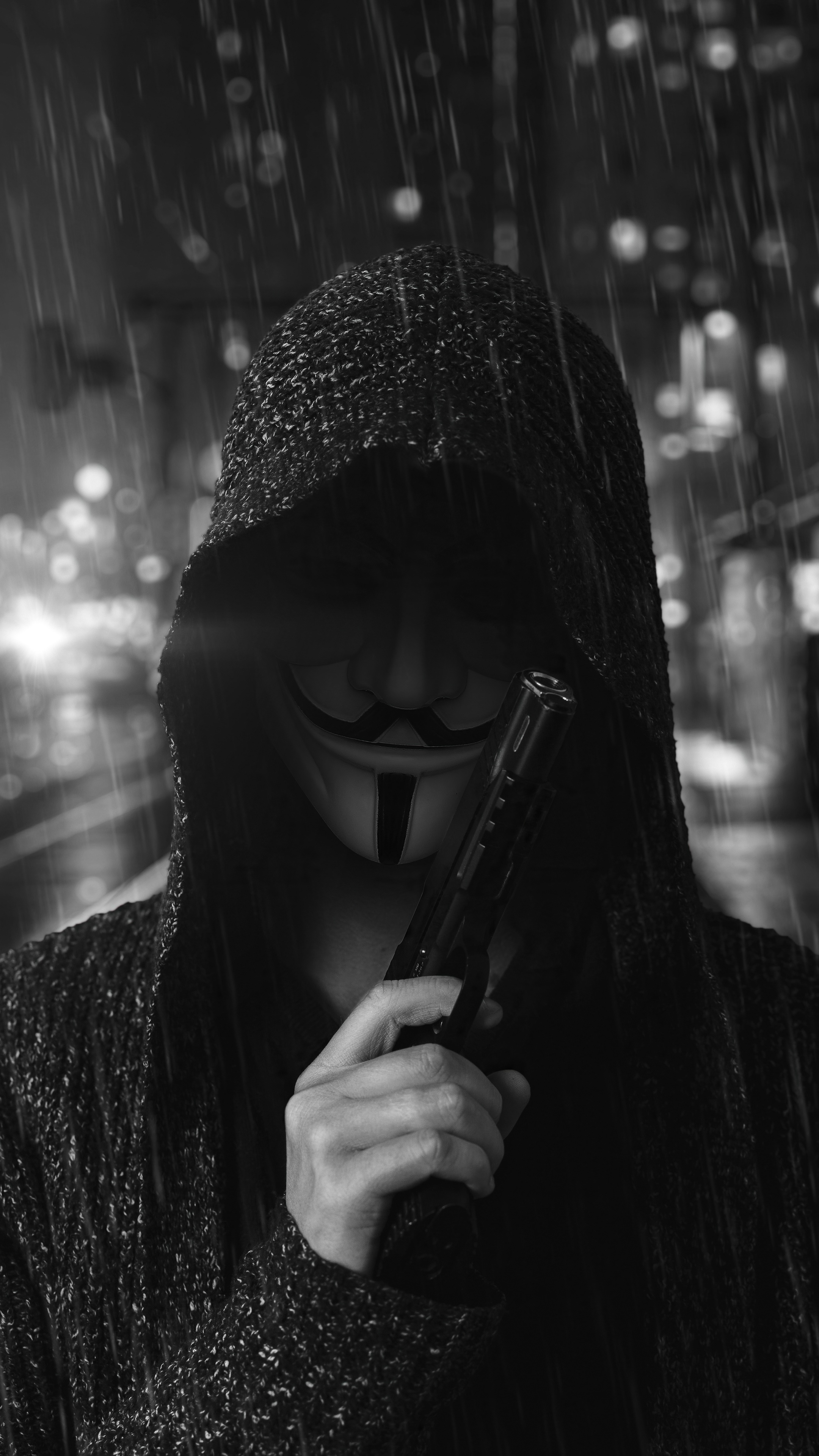 Anonymous figure with a gun in the rain HD Phone Wallpaper