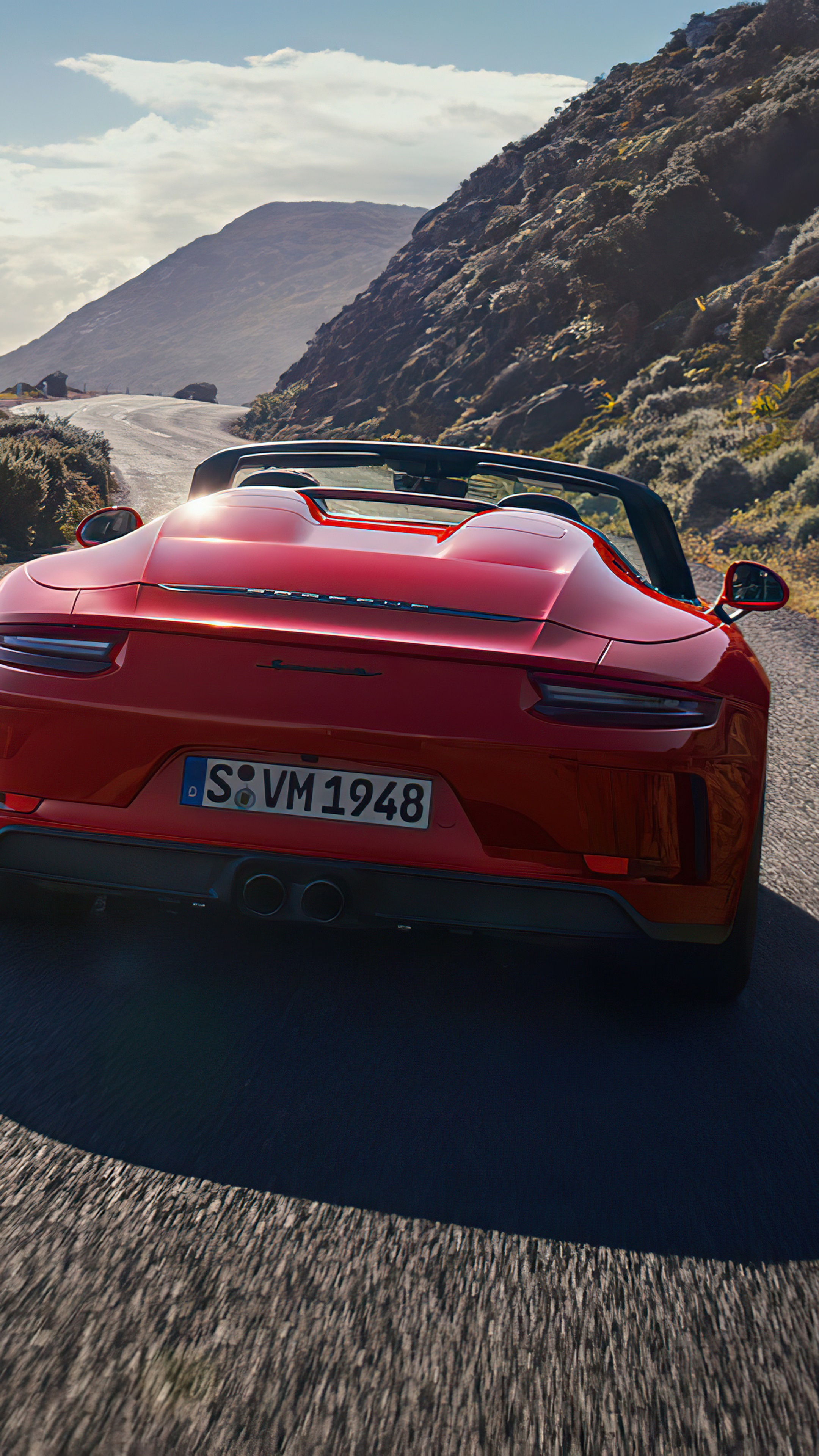 Red Porsche 911 Speedster driving on a mountain road HD Phone Wallpaper