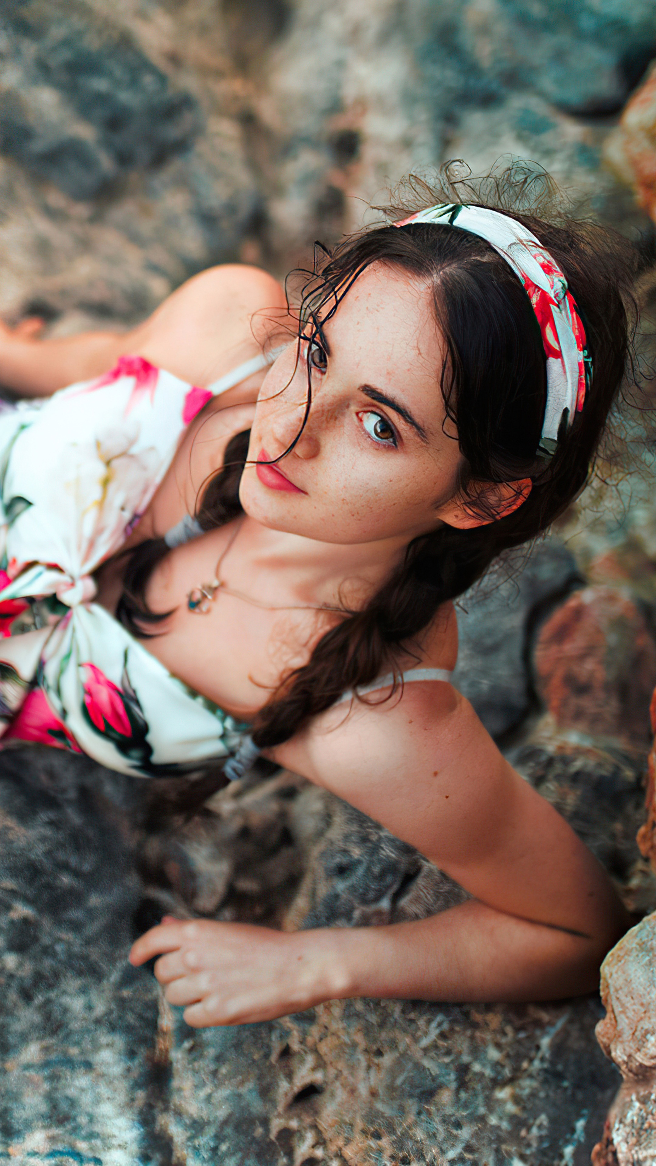 Girl with braids and floral dress on rocks HD Phone Wallpaper