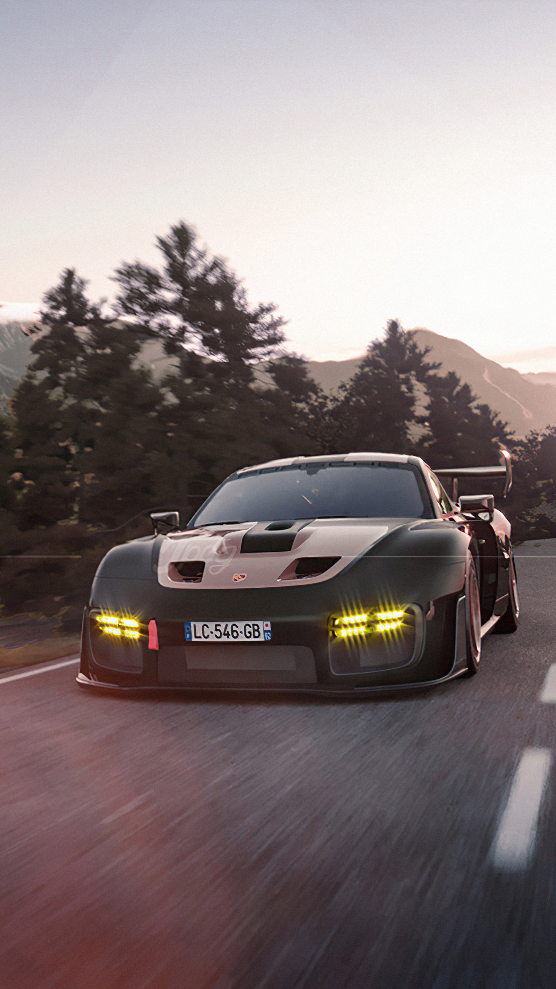 Porsche 935 driving on a mountain road at sunset HD Phone Wallpaper
