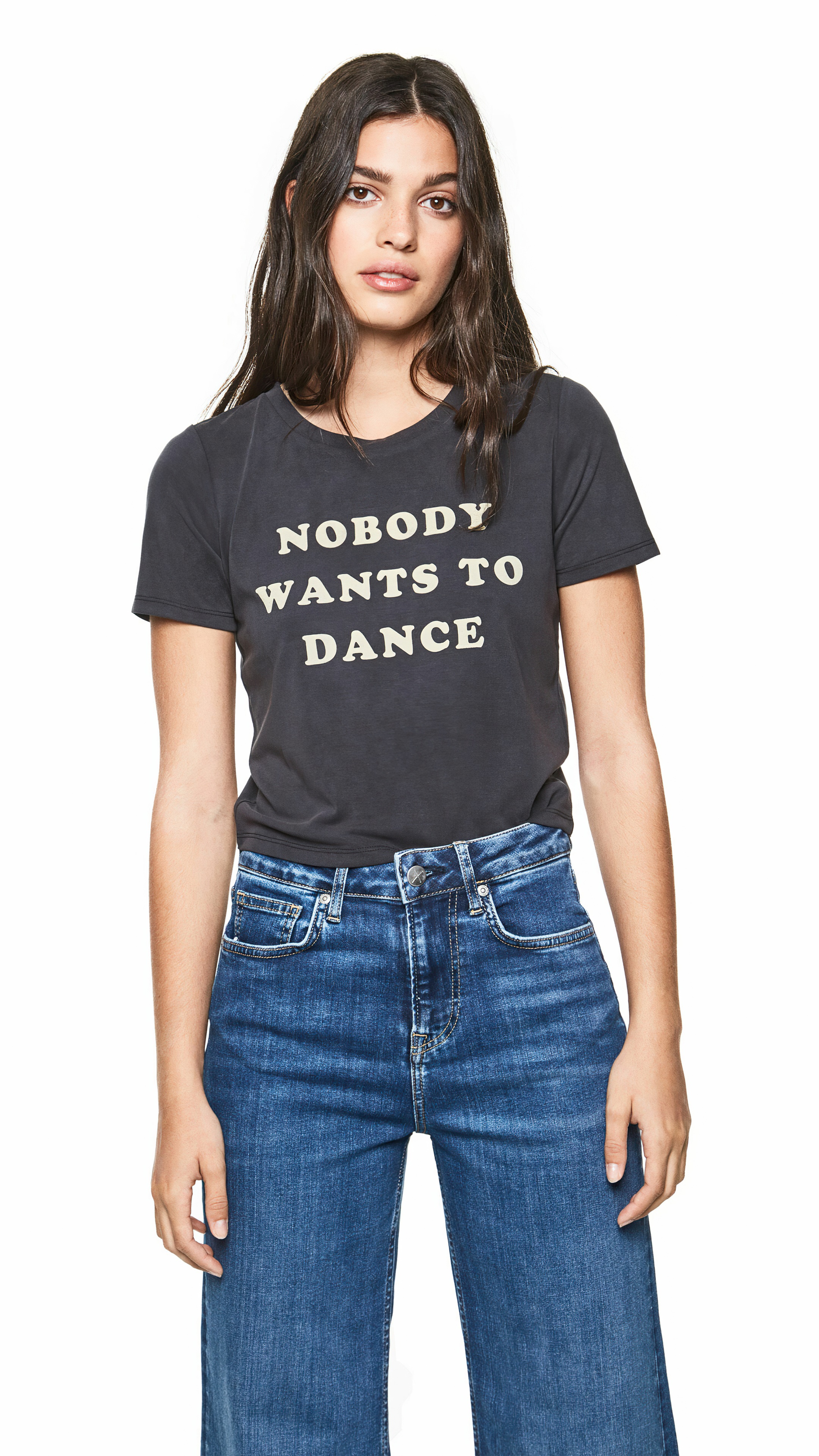 Woman wearing a t-shirt with text and jeans HD Phone Wallpaper