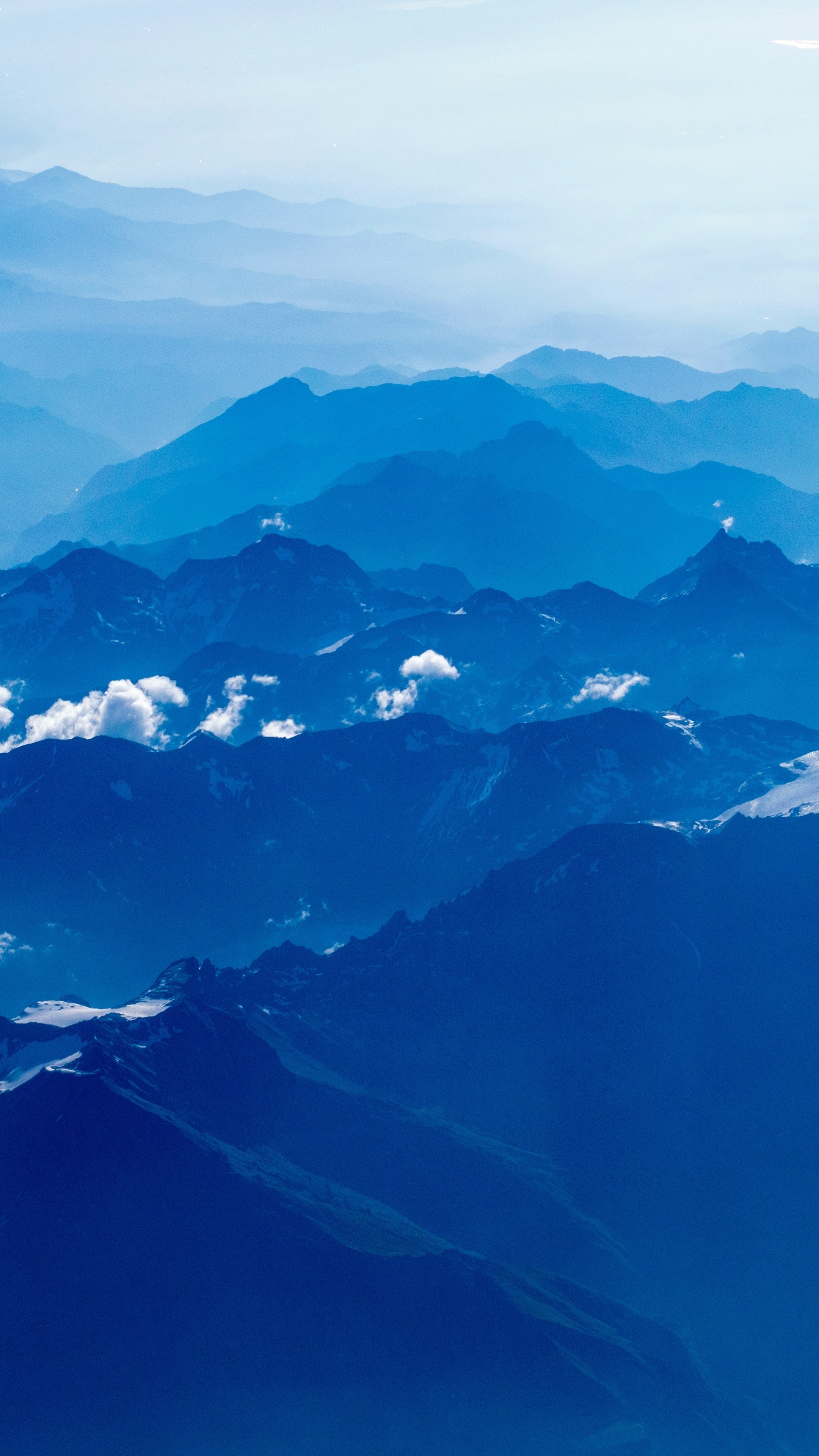 Aerial view of blue mountain ranges with clouds HD Phone Wallpaper