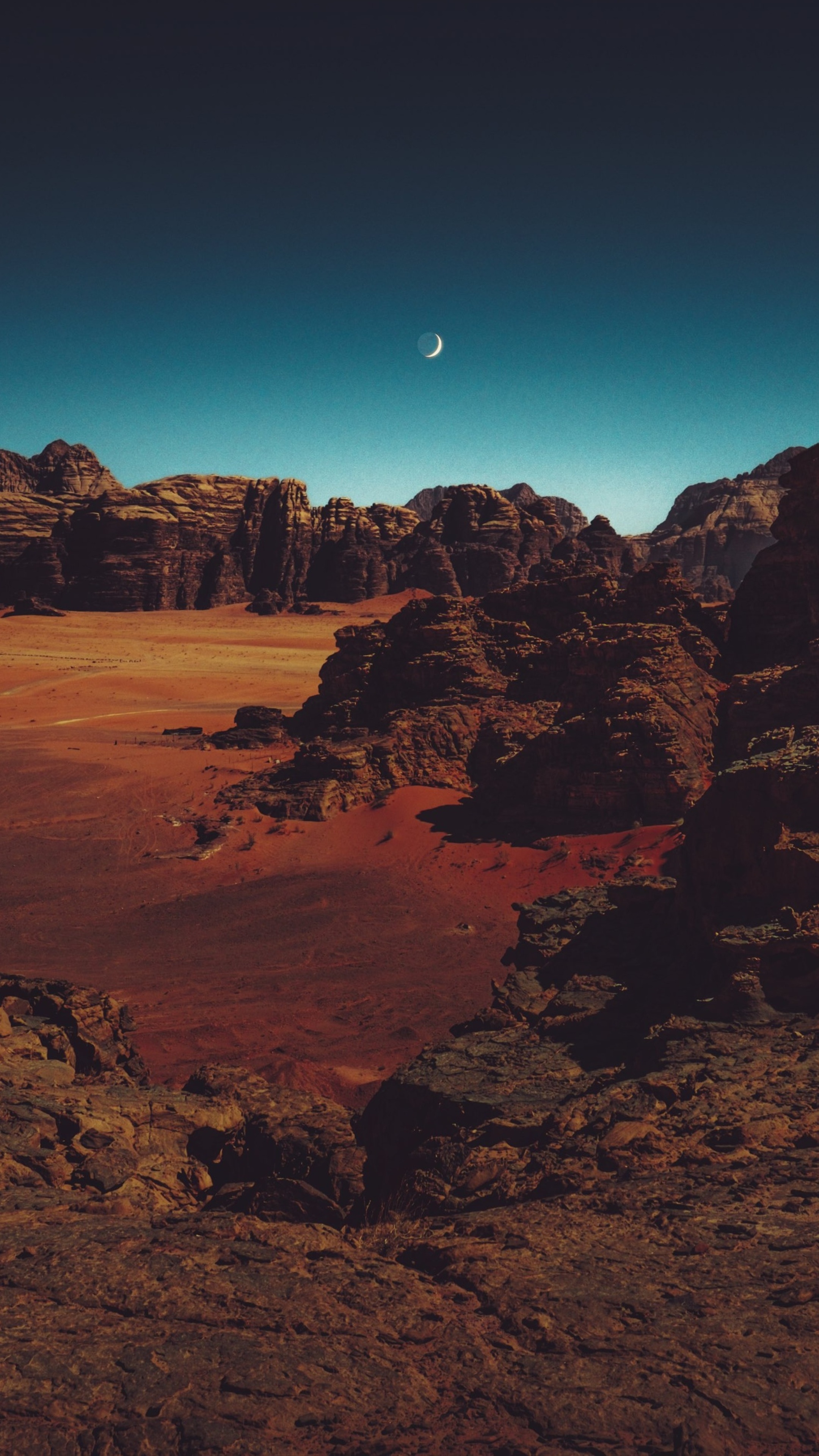 Crescent moon over rocky desert landscape 4K HD Phone Wallpaper