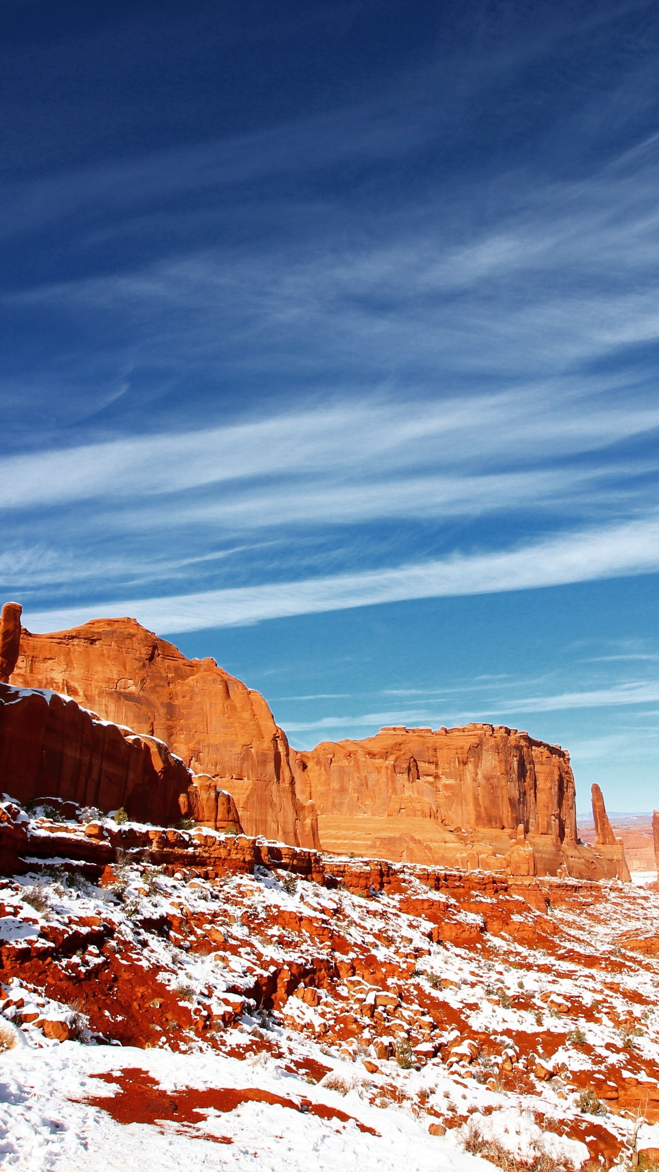 Red rock formations with snow under a blue sky with clouds HD Phone Wallpaper