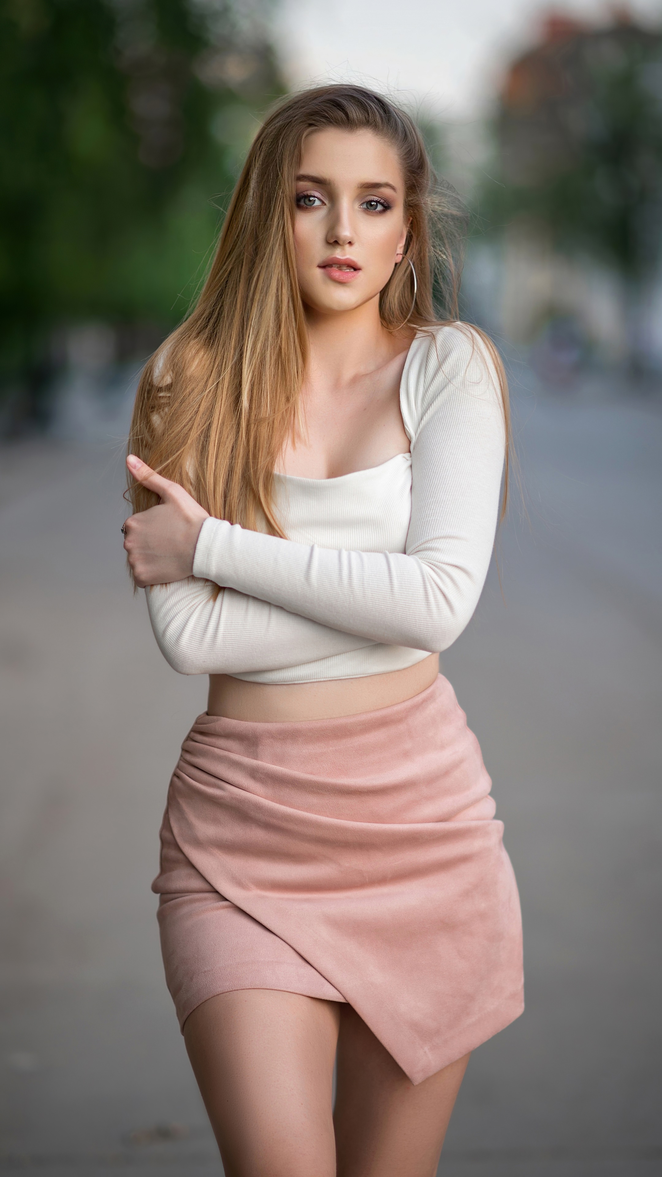 Blonde model in white top and pink skirt HD Phone Wallpaper