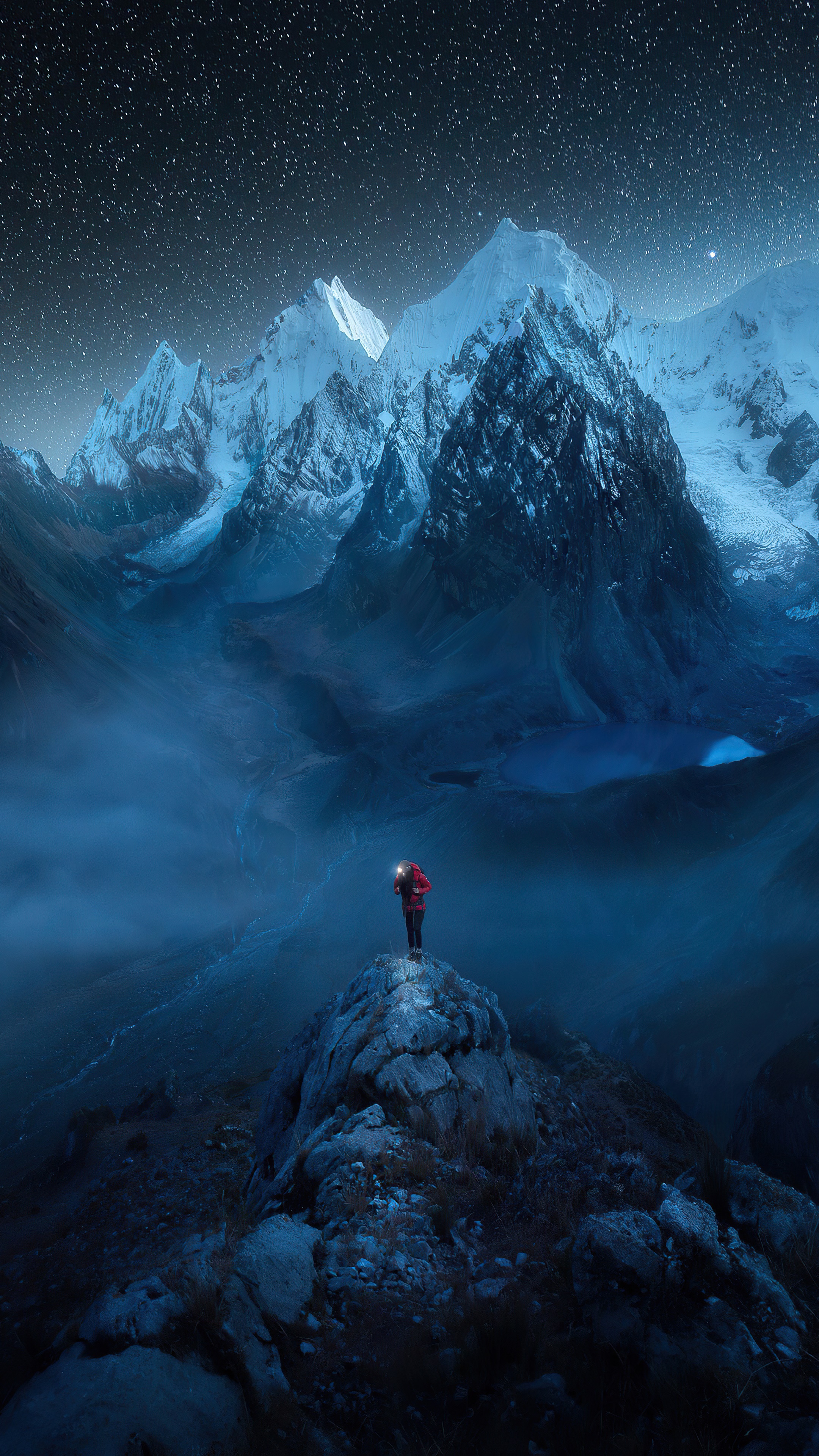 Man with headlamp on mountain peak under starry sky HD Phone Wallpaper