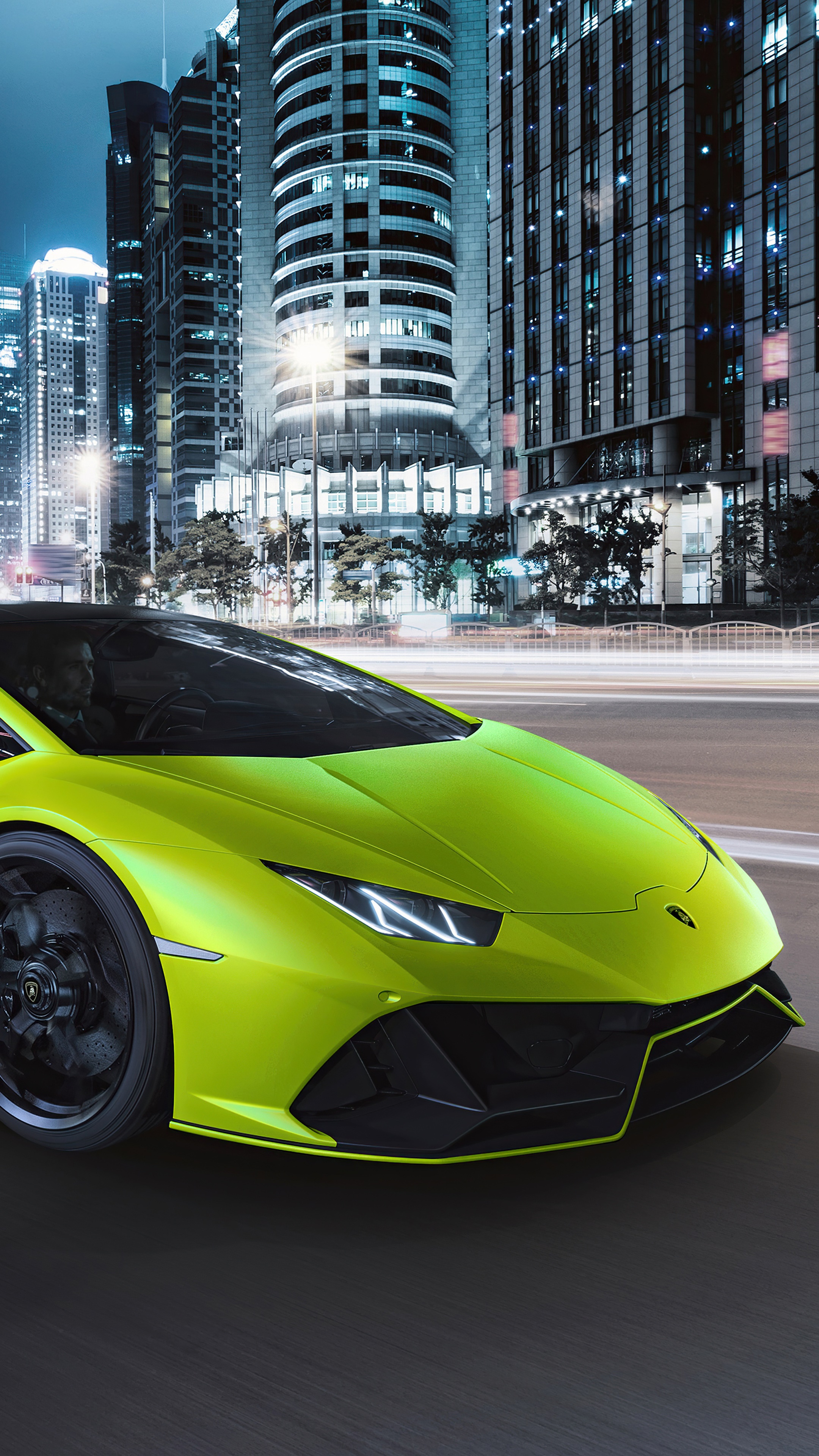 Lime green Lamborghini Huracan driving in city at night HD Phone Wallpaper