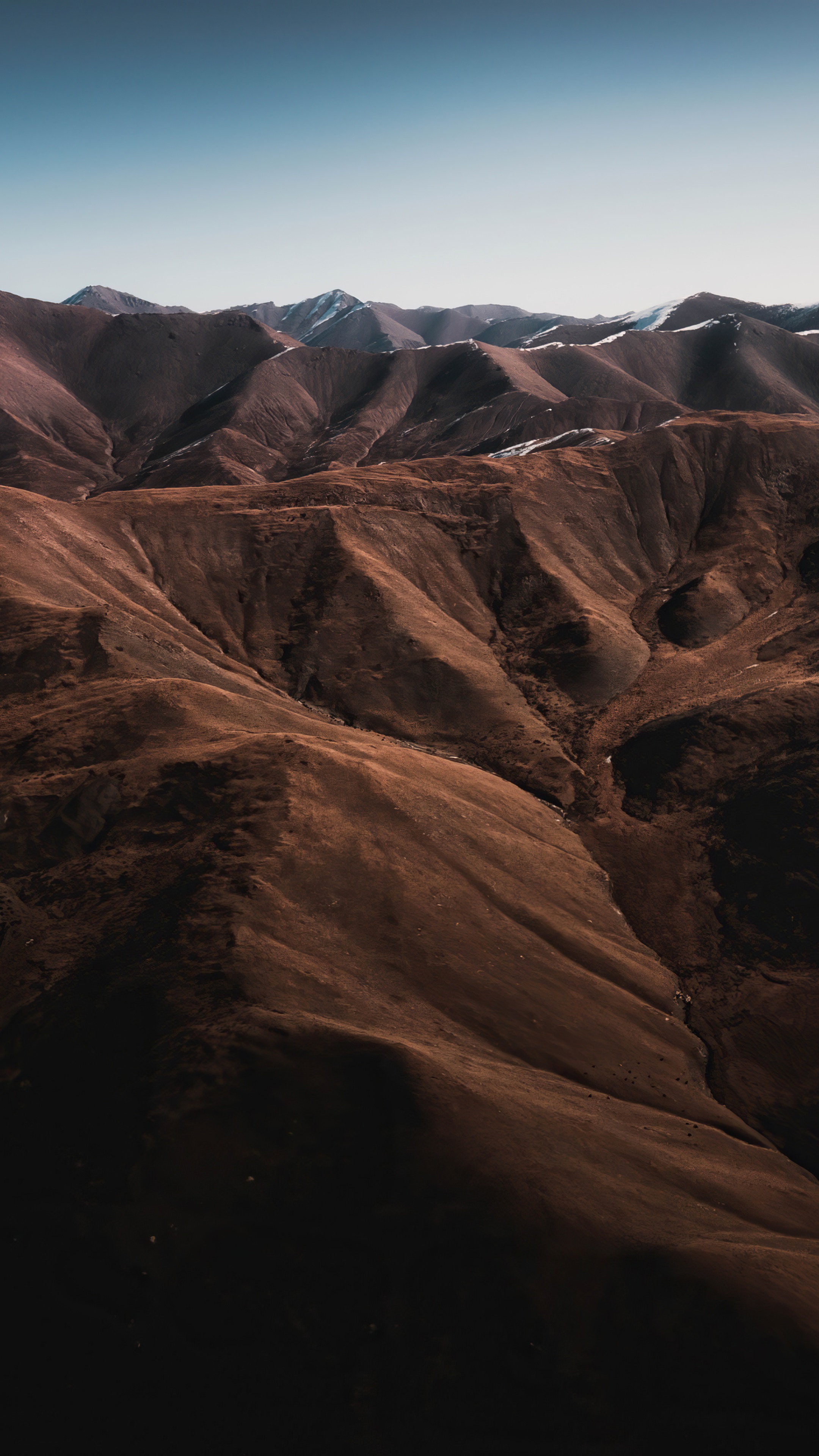 Brown mountains under a clear blue sky HD Phone Wallpaper