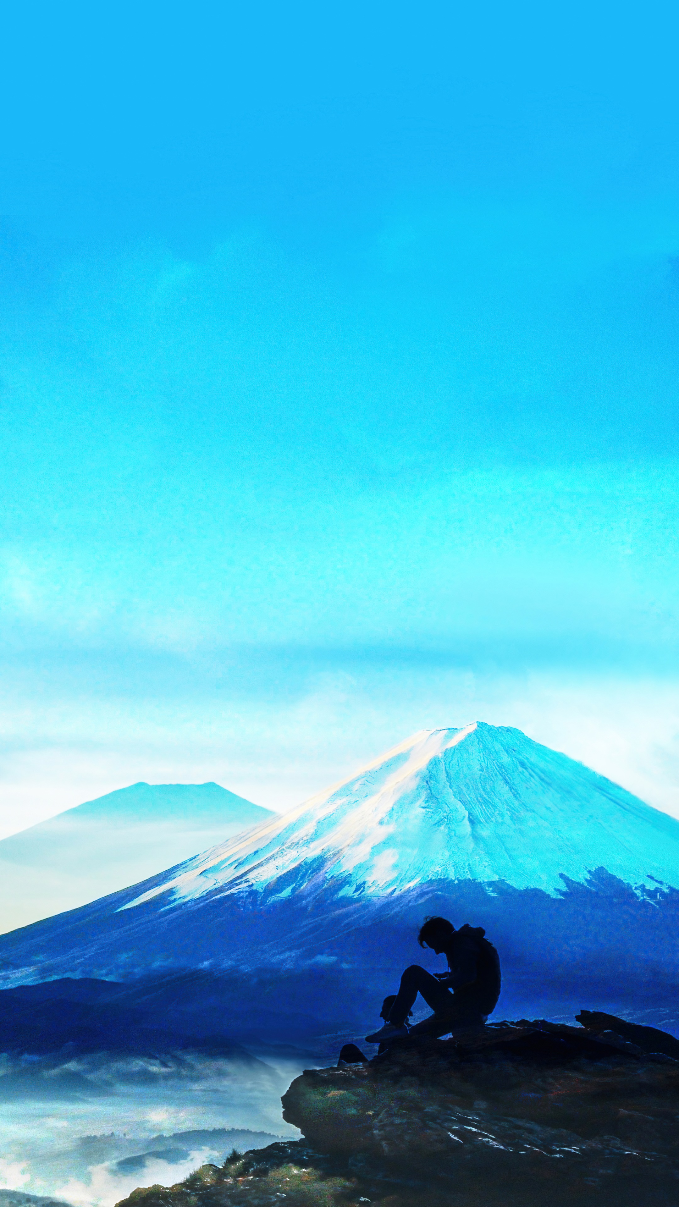 Silhouette of a person sitting on a cliff overlooking mountains HD Phone Wallpaper