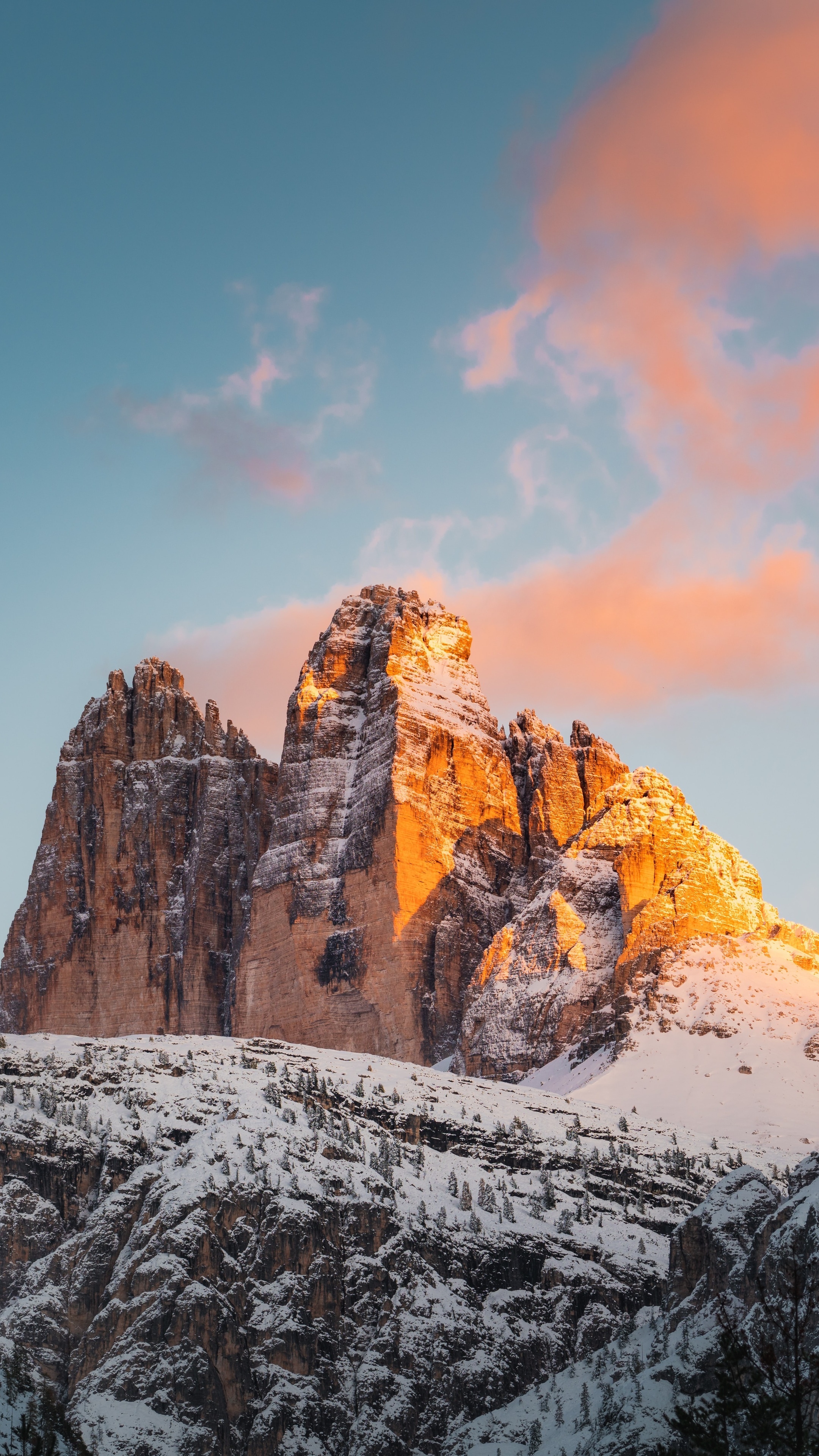 Snow-covered mountains at sunset with pink clouds HD Phone Wallpaper