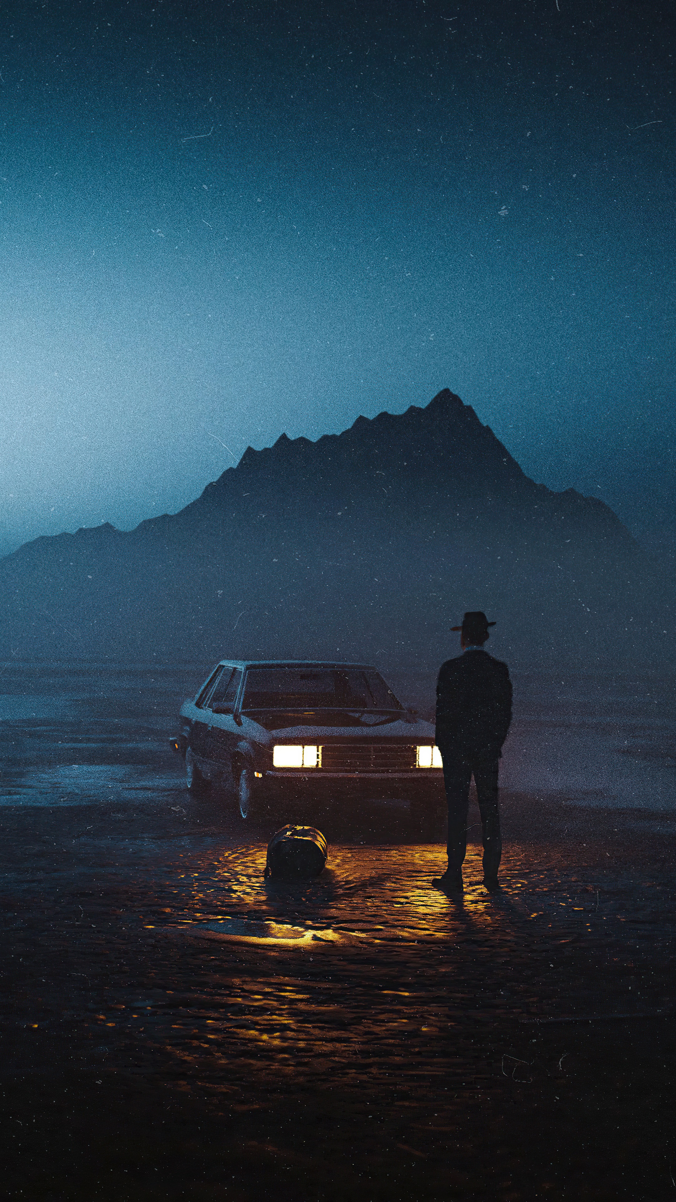 Man standing by a car in a desolate landscape HD Phone Wallpaper