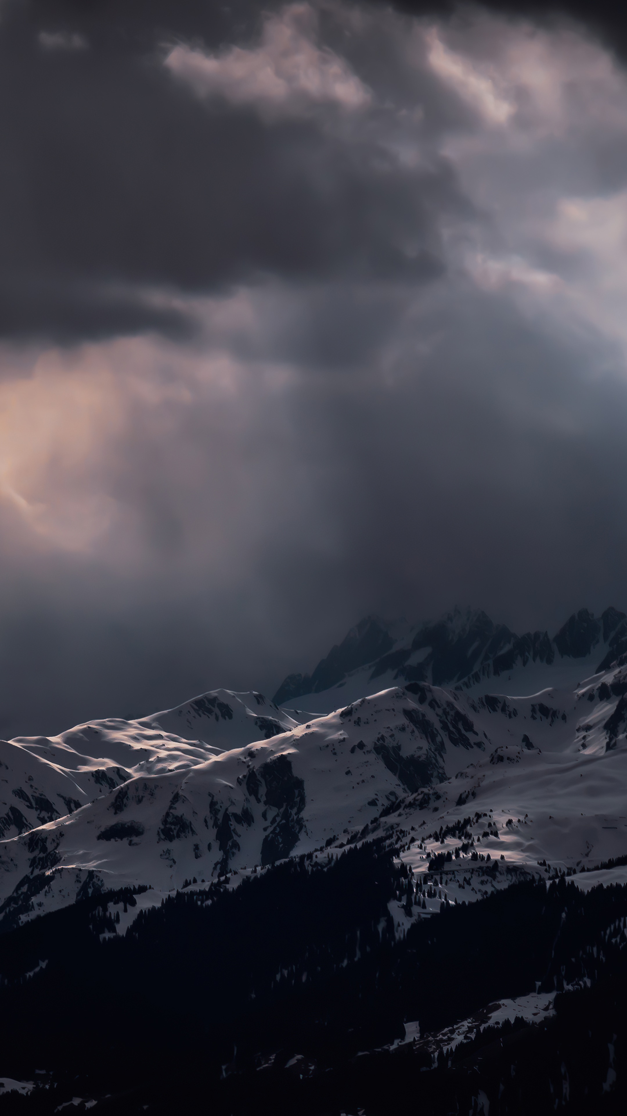 Snowy mountains under dark clouds HD Phone Wallpaper