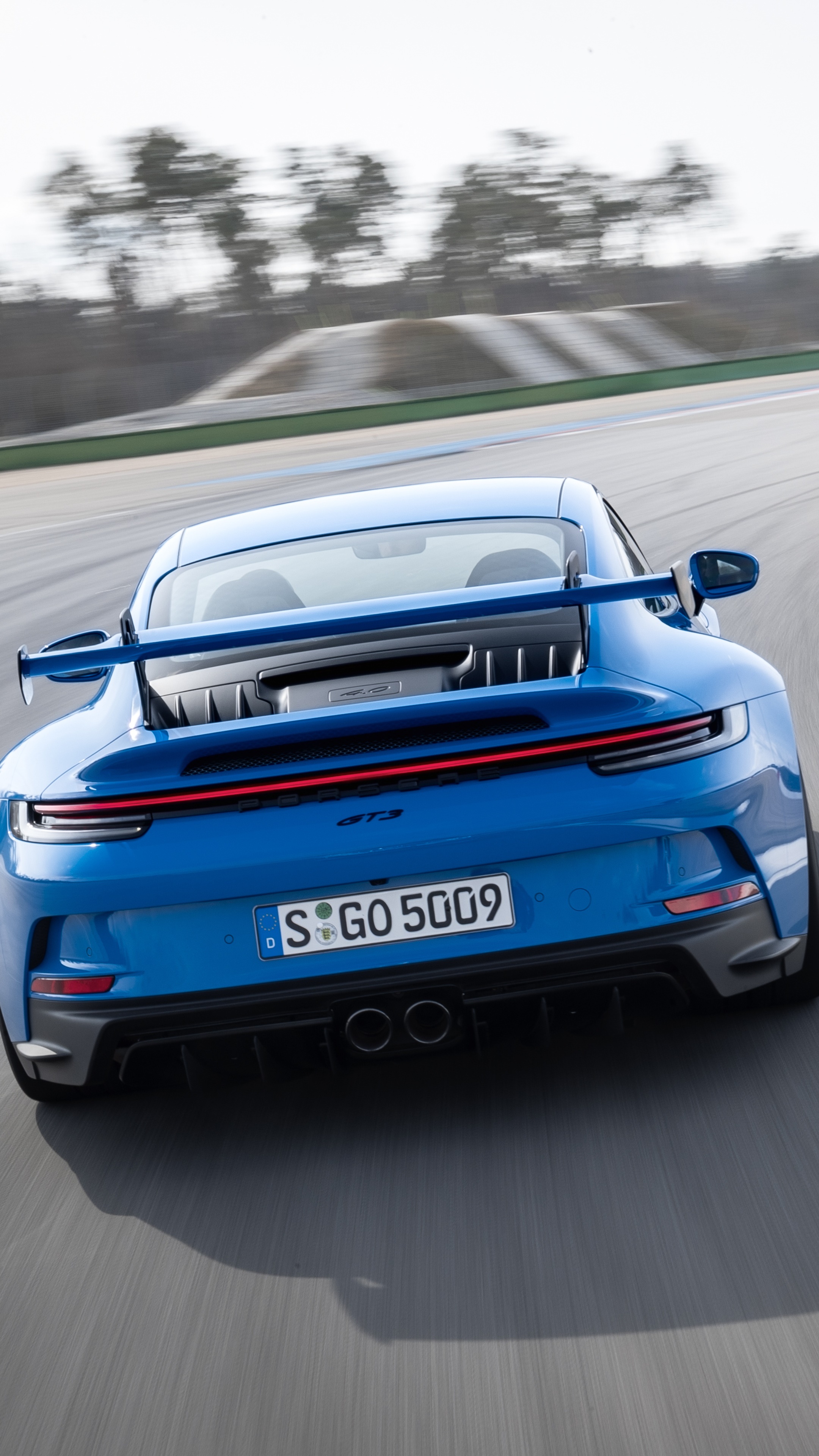 Blue Porsche 911 GT3 on a Racetrack HD Phone Wallpaper