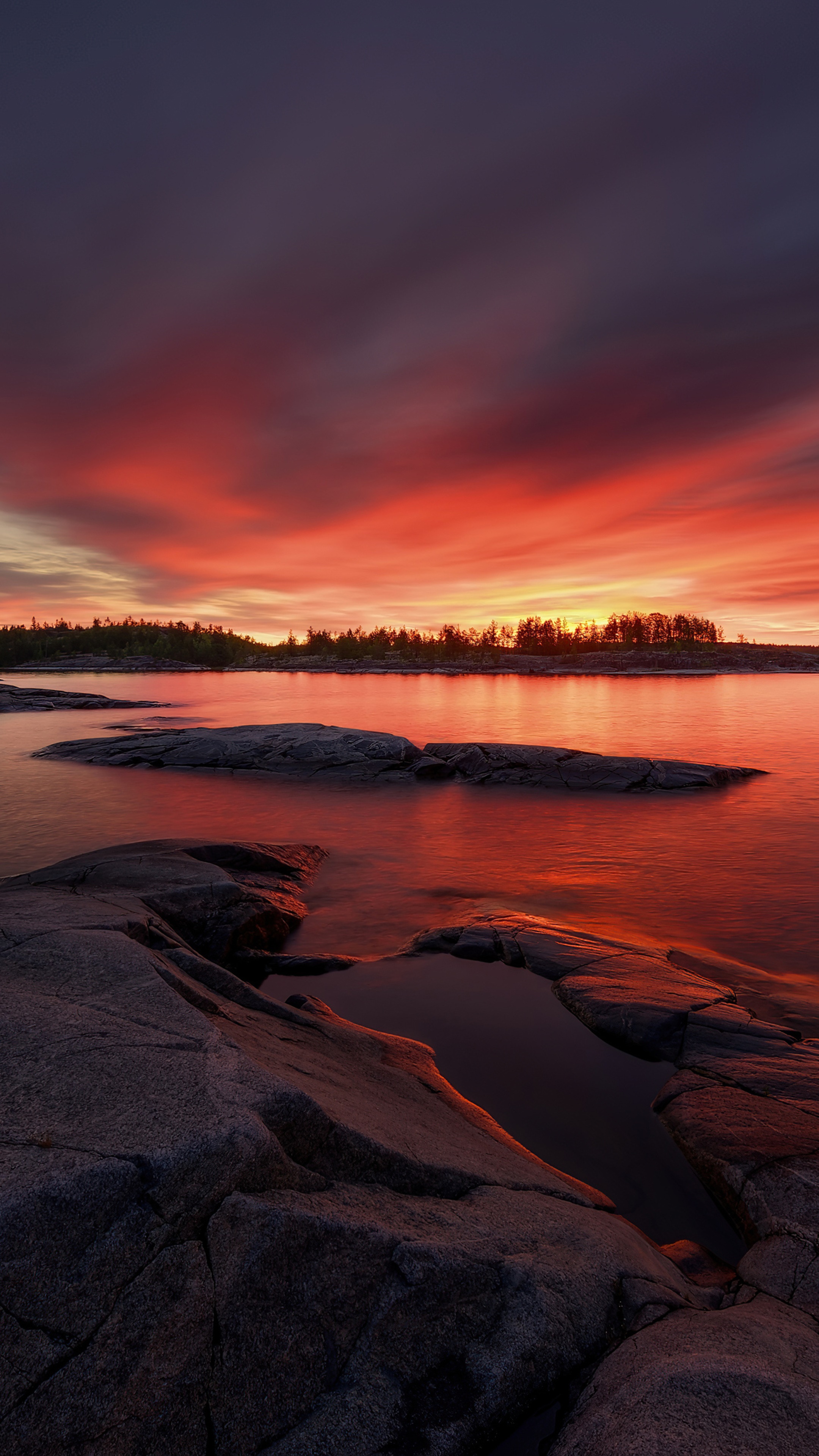 Sunset over rocky lake shore 4K HD Phone Wallpaper