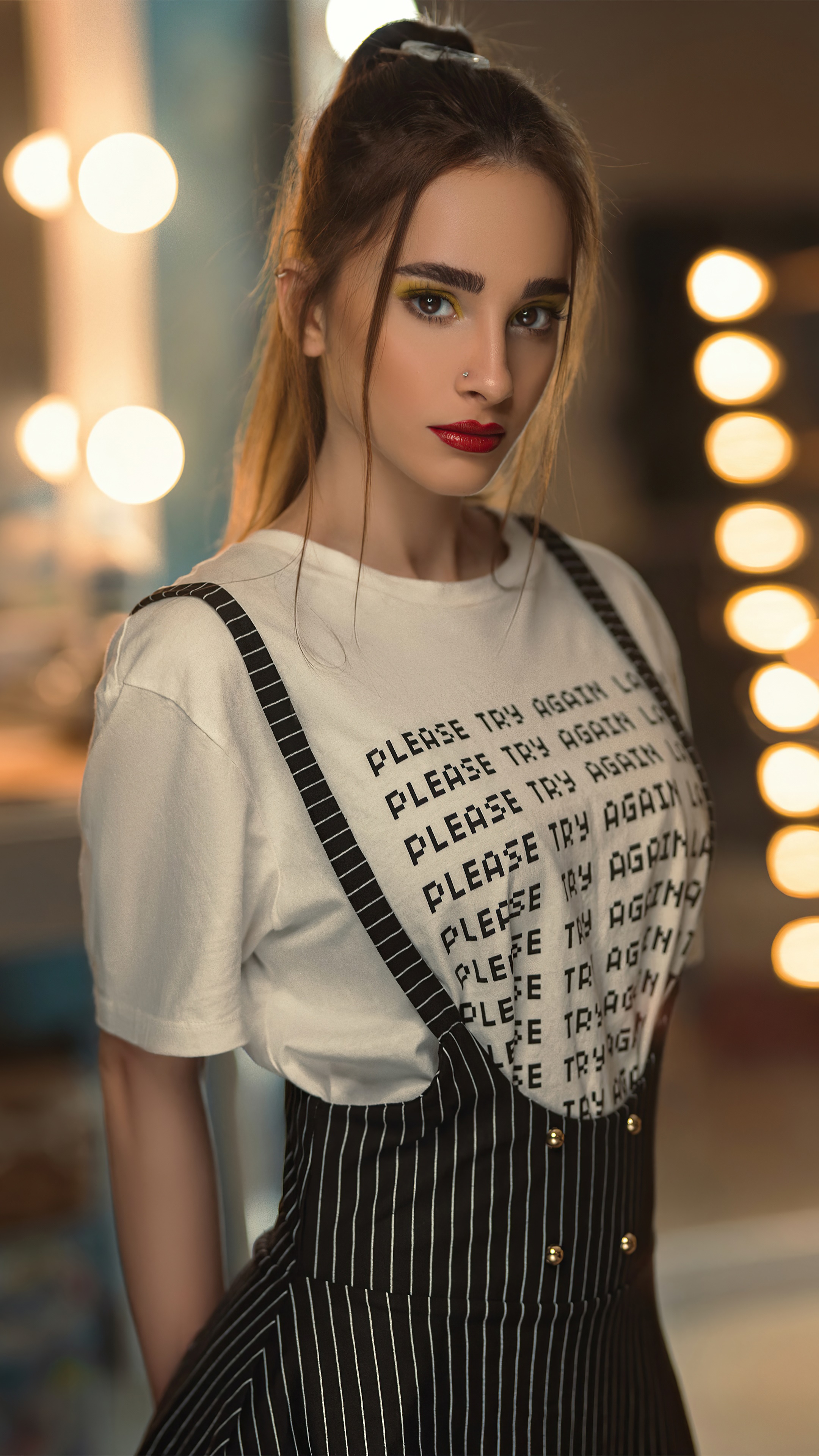 Woman wearing a white t-shirt with text and overalls HD Phone Wallpaper