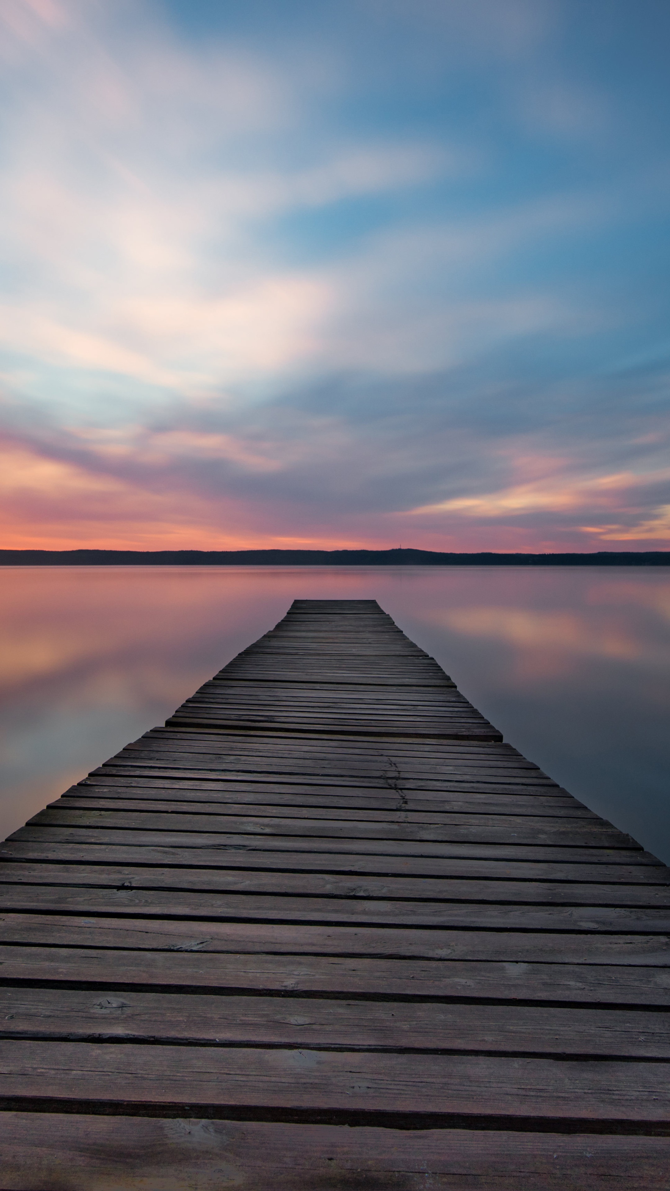 Wooden pier on a lake at sunset 4K HD Phone Wallpaper
