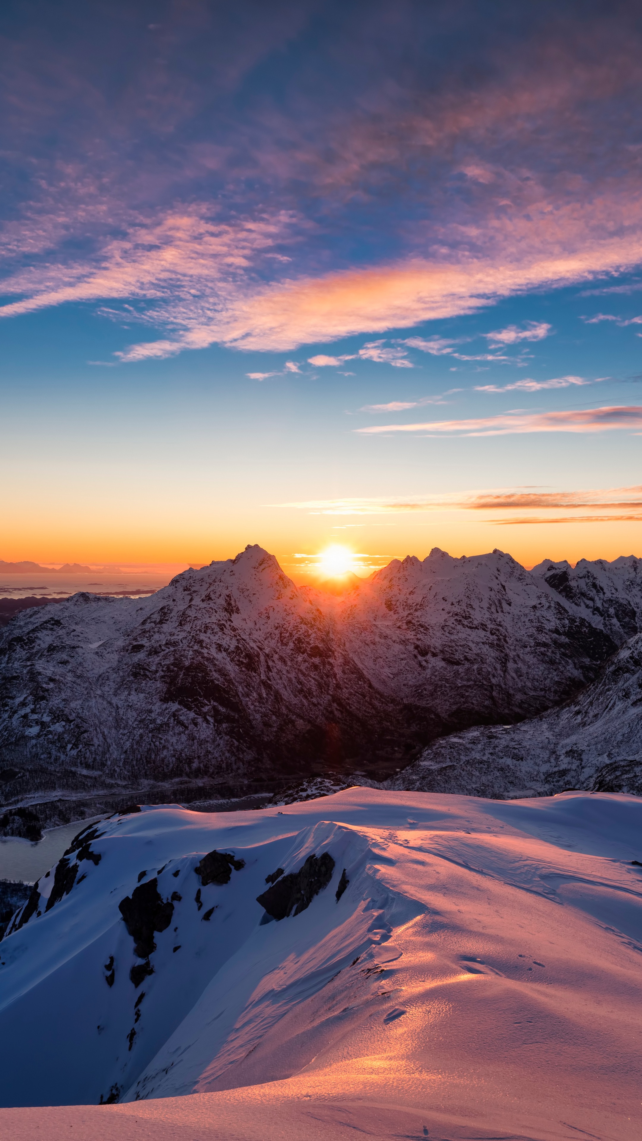 Sunset over snow-covered mountains HD Phone Wallpaper