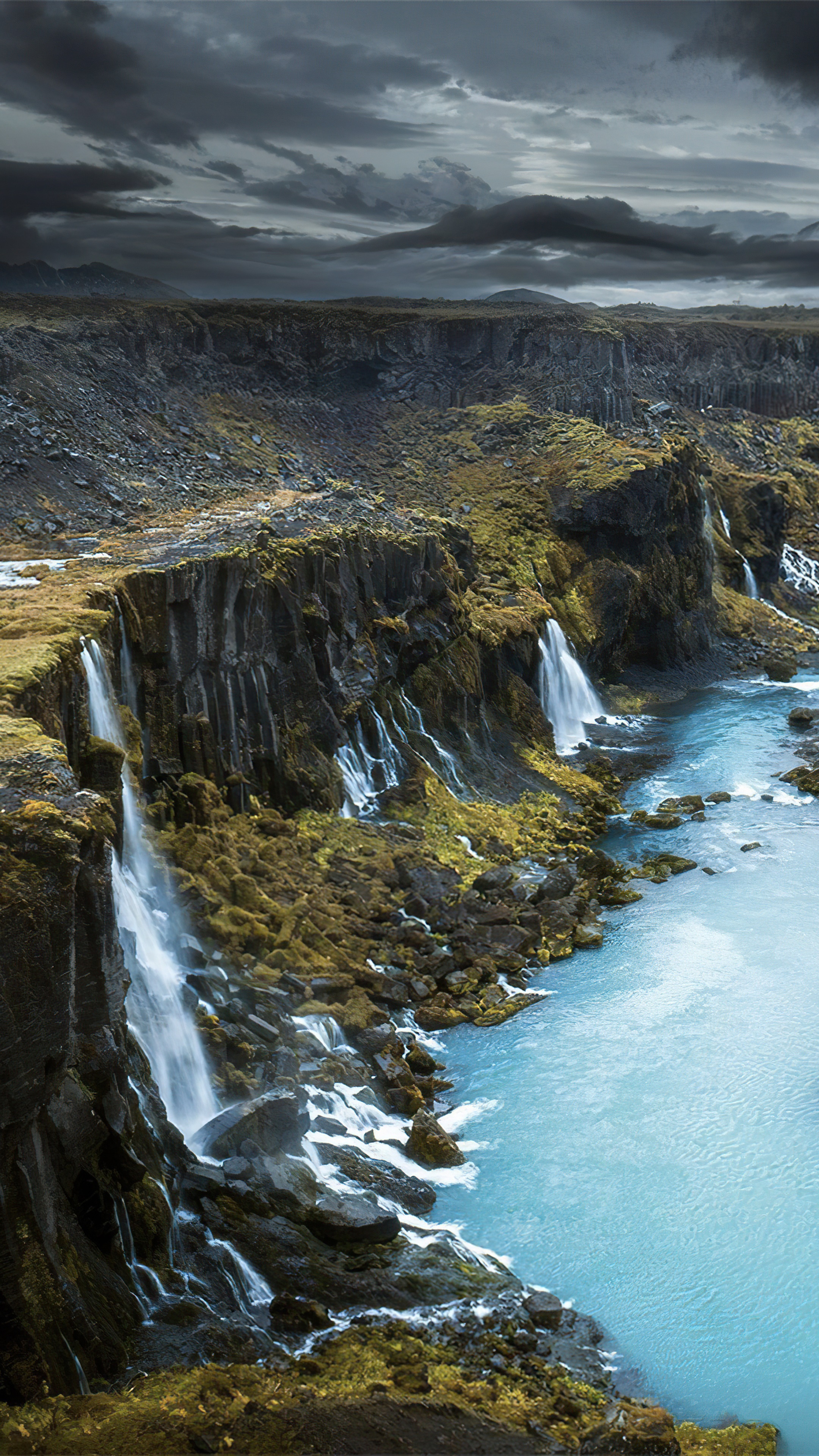 Waterfalls in Iceland under cloudy sky 4K HD Phone Wallpaper