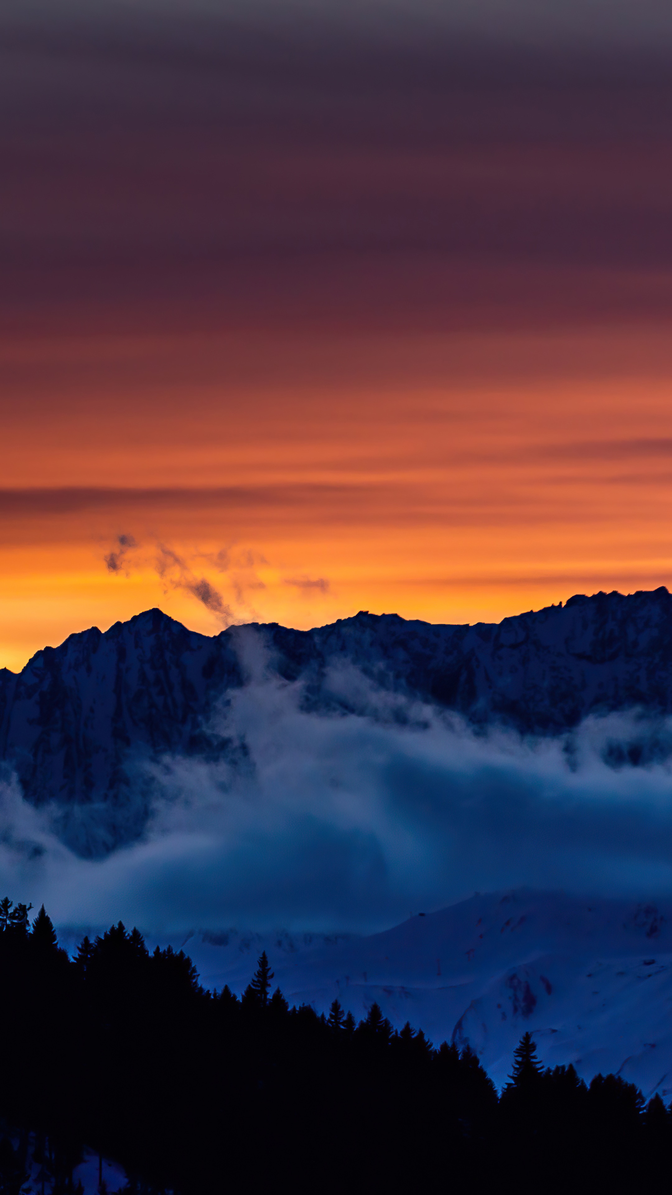 Sunset over mountains with clouds and trees HD Phone Wallpaper