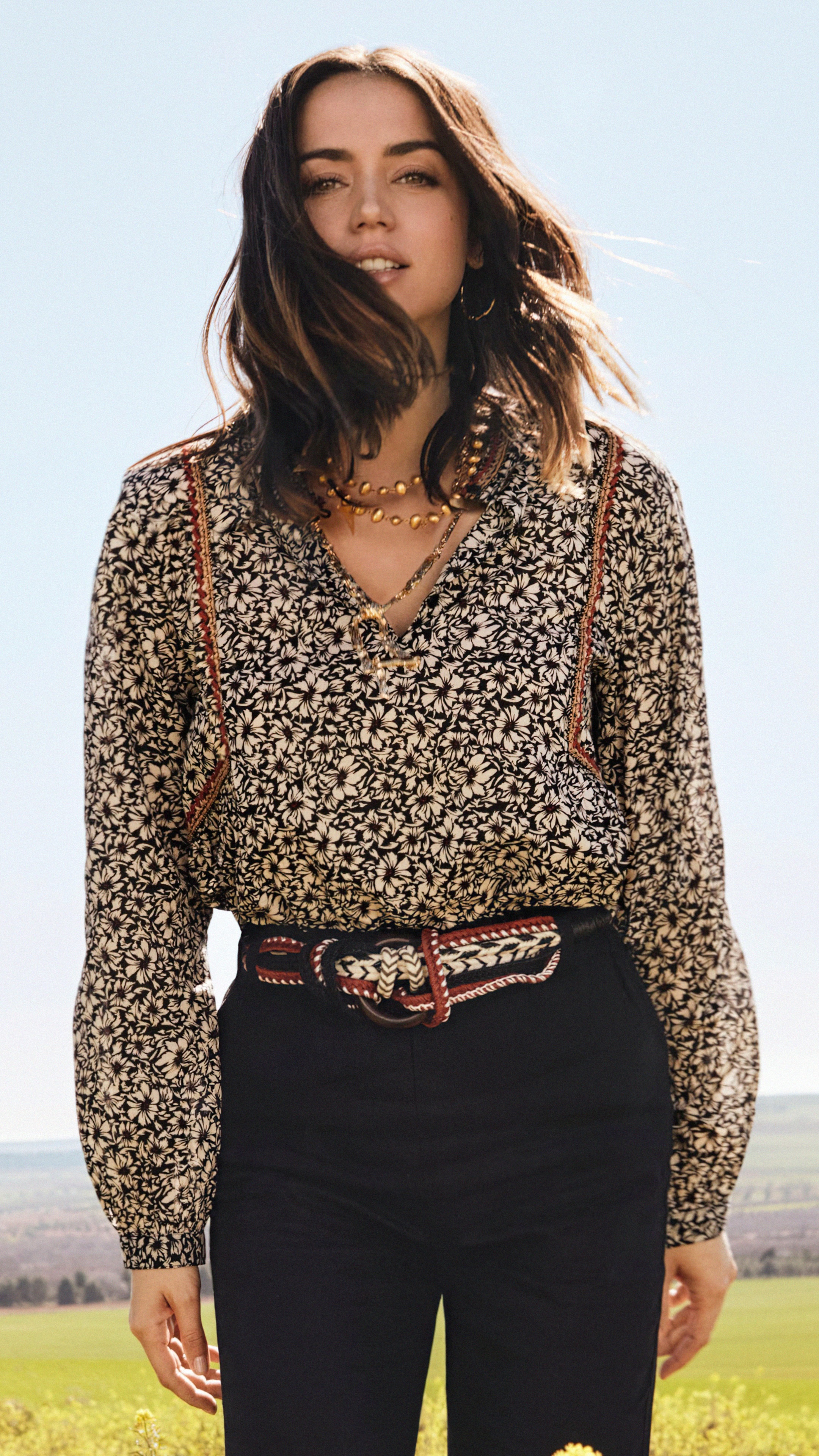 Ana de Armas in a floral blouse and black pants HD Phone Wallpaper
