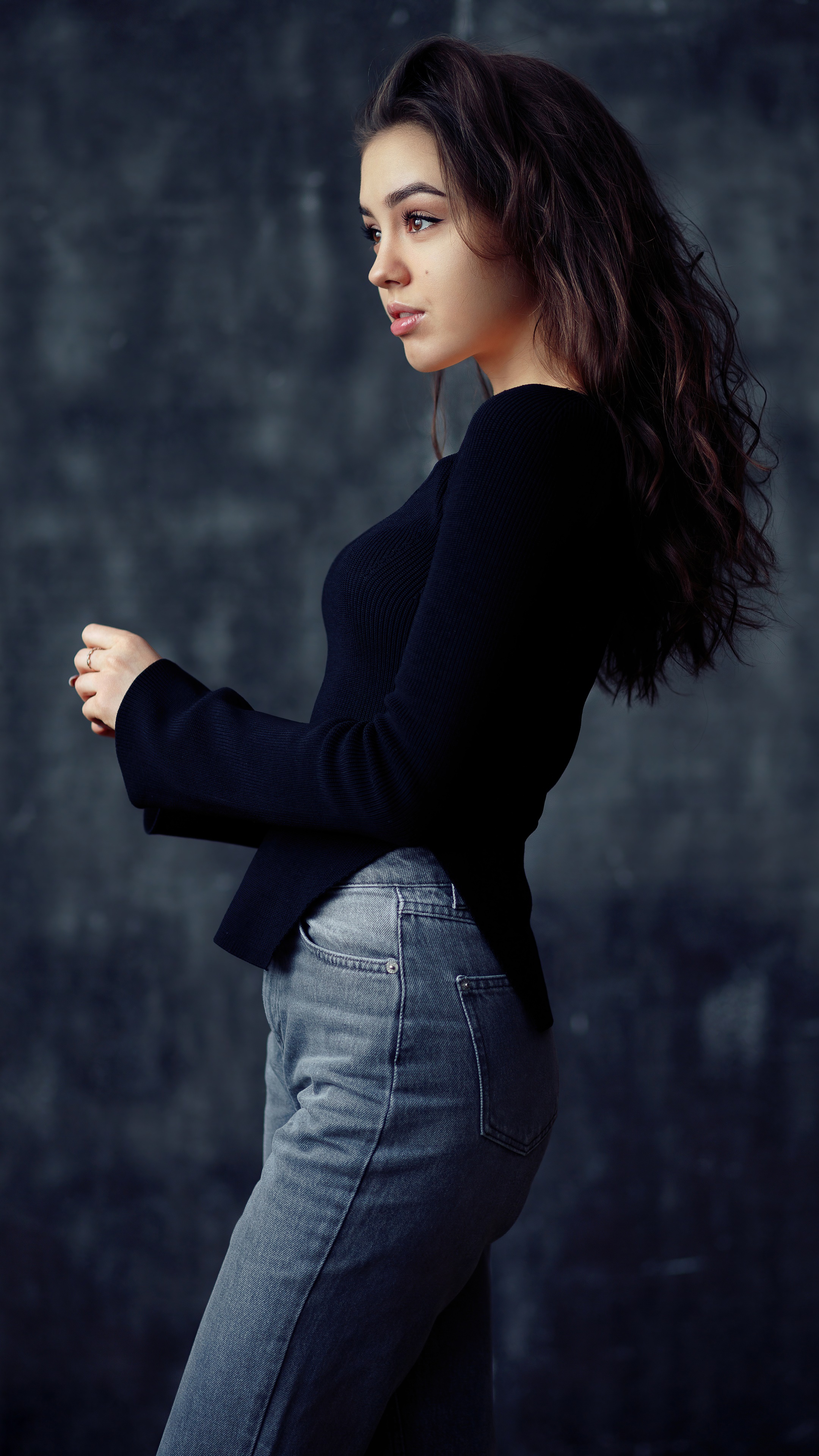 Girl in black top and denim jeans posing HD Phone Wallpaper