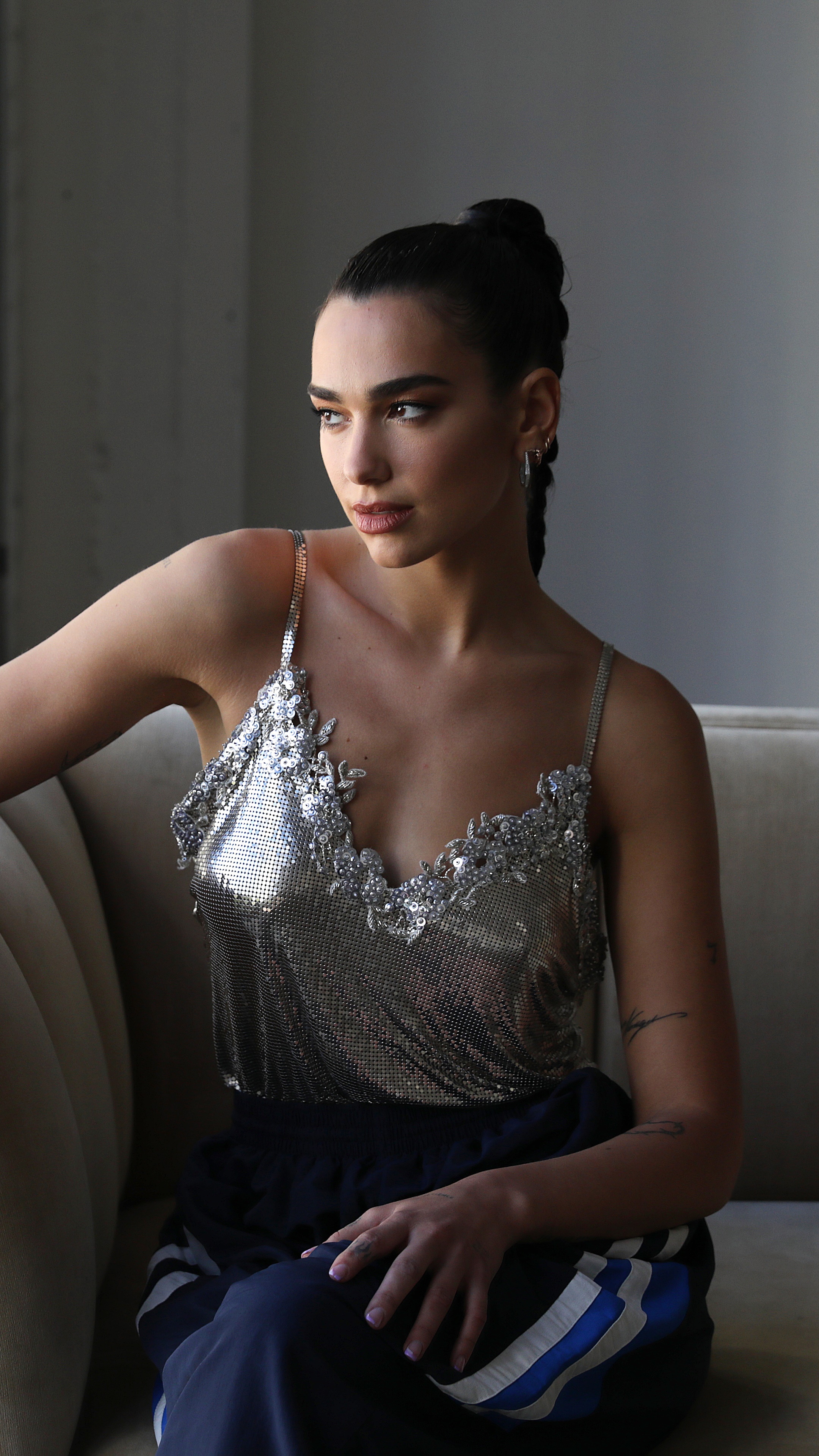 Dua Lipa in a silver top HD Phone Wallpaper