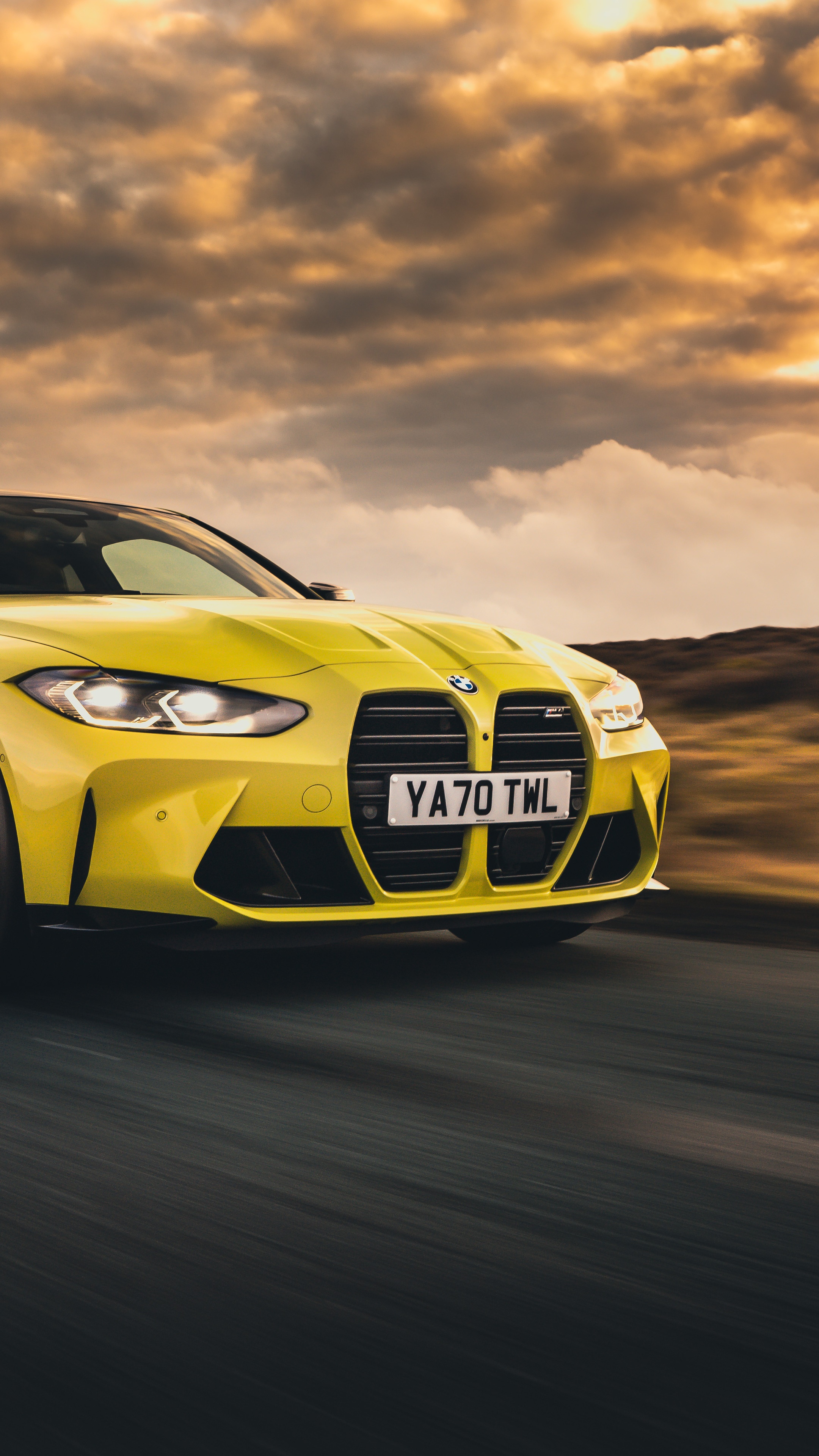 Yellow BMW M4 on a Road HD Phone Wallpaper
