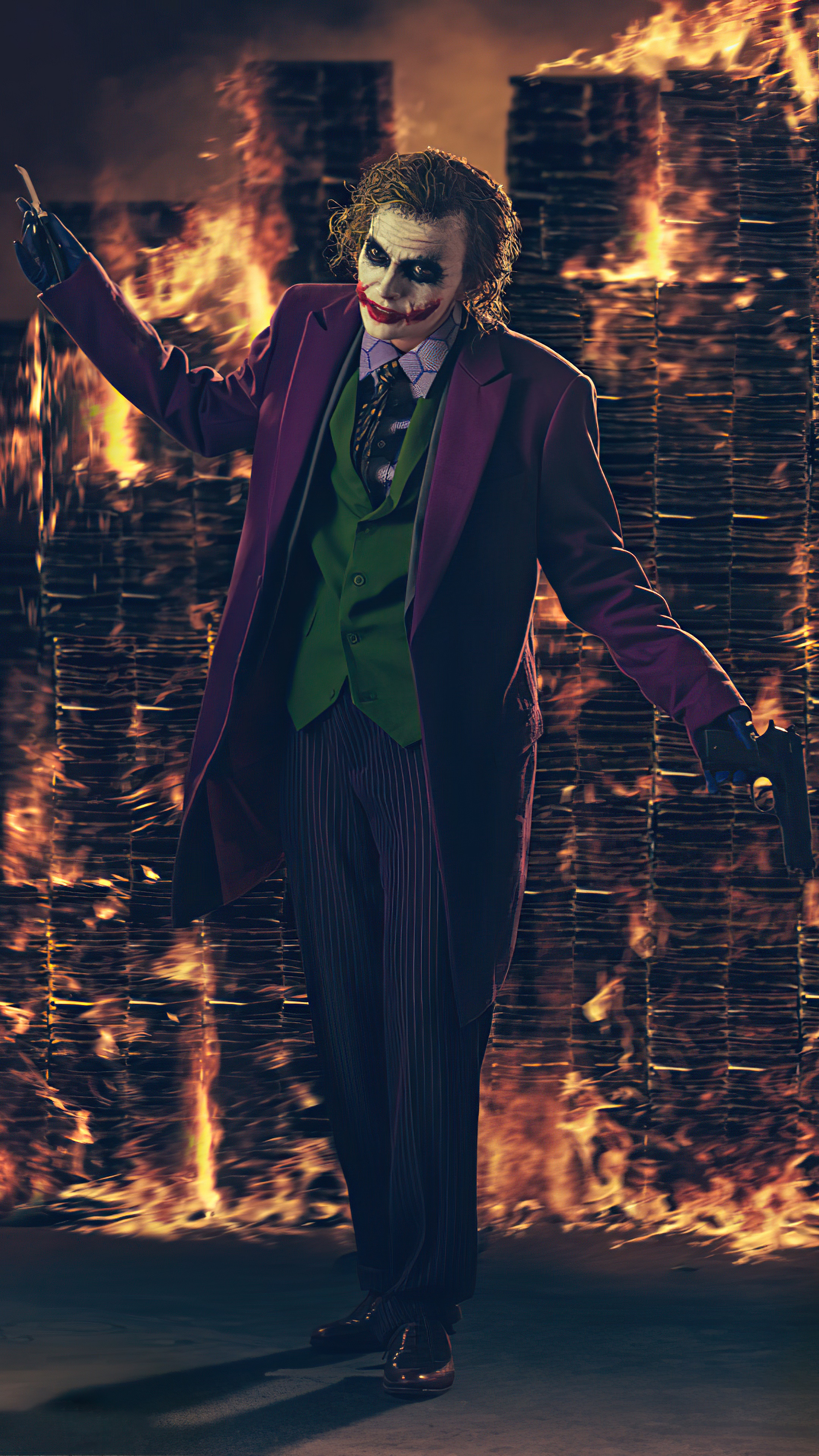 Joker from Batman standing in front of a fire HD Phone Wallpaper
