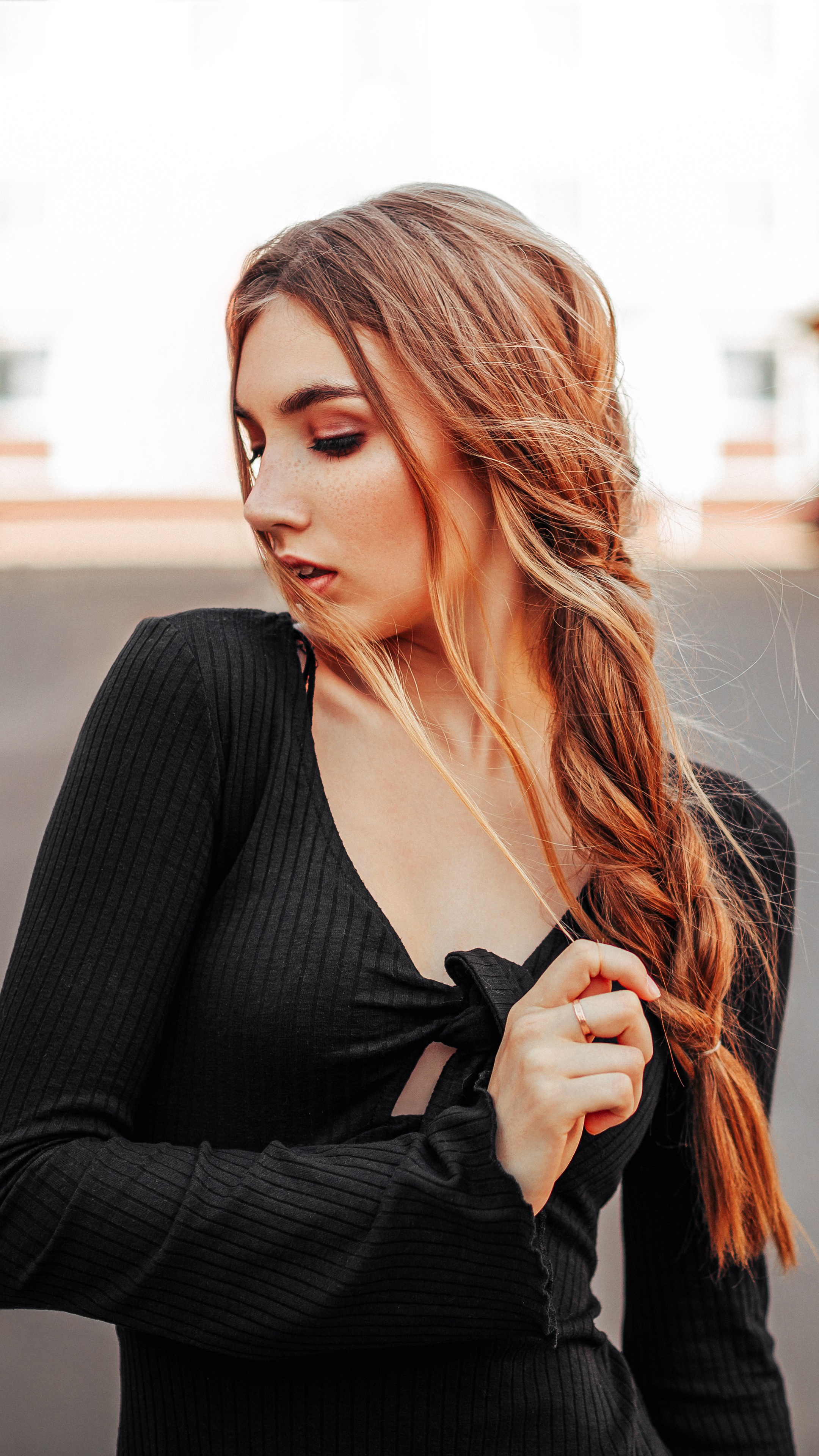 Woman with blonde hair in a black dress HD Phone Wallpaper