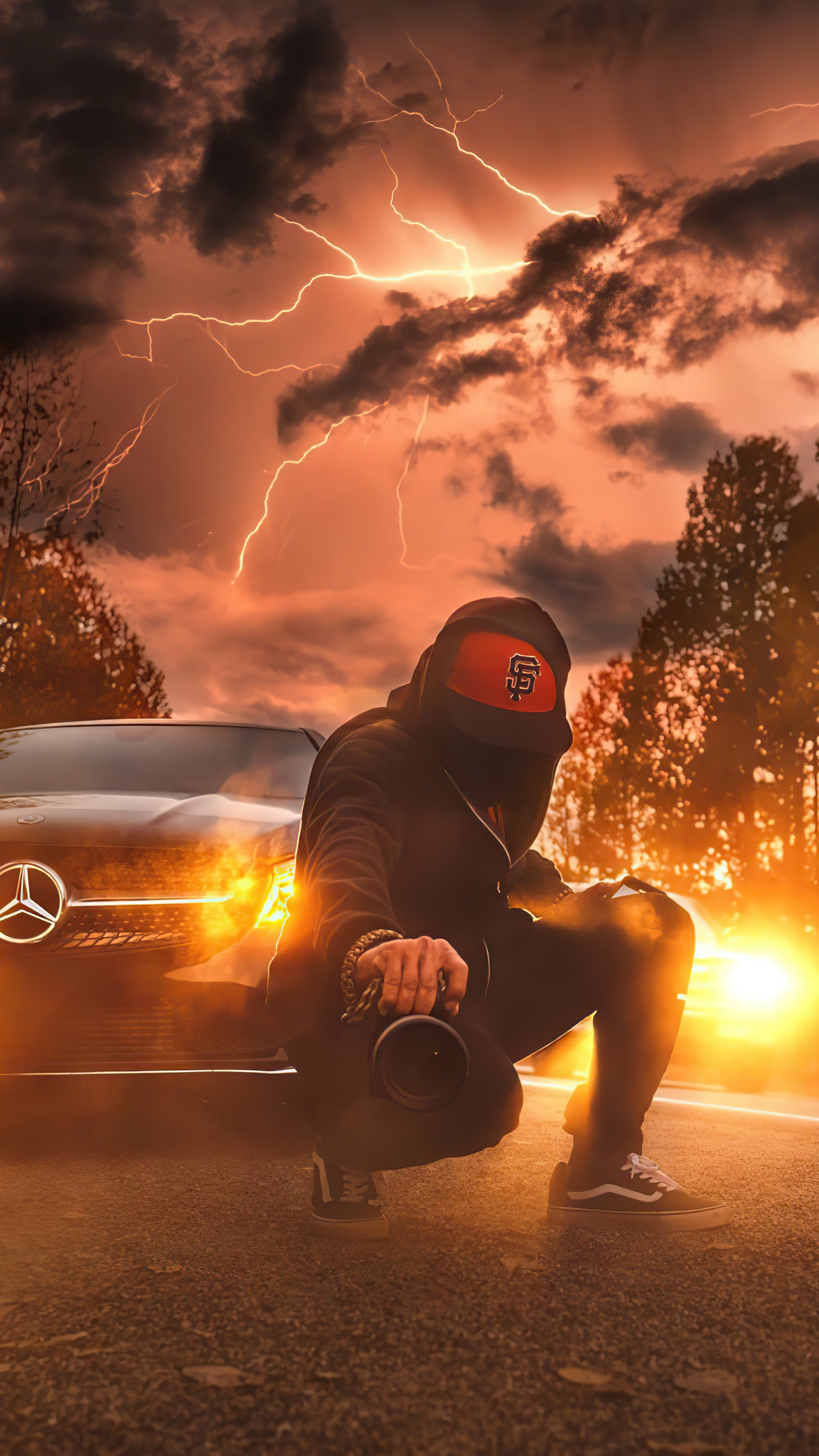 Man with camera and Mercedes-Benz during lightning storm HD Phone Wallpaper